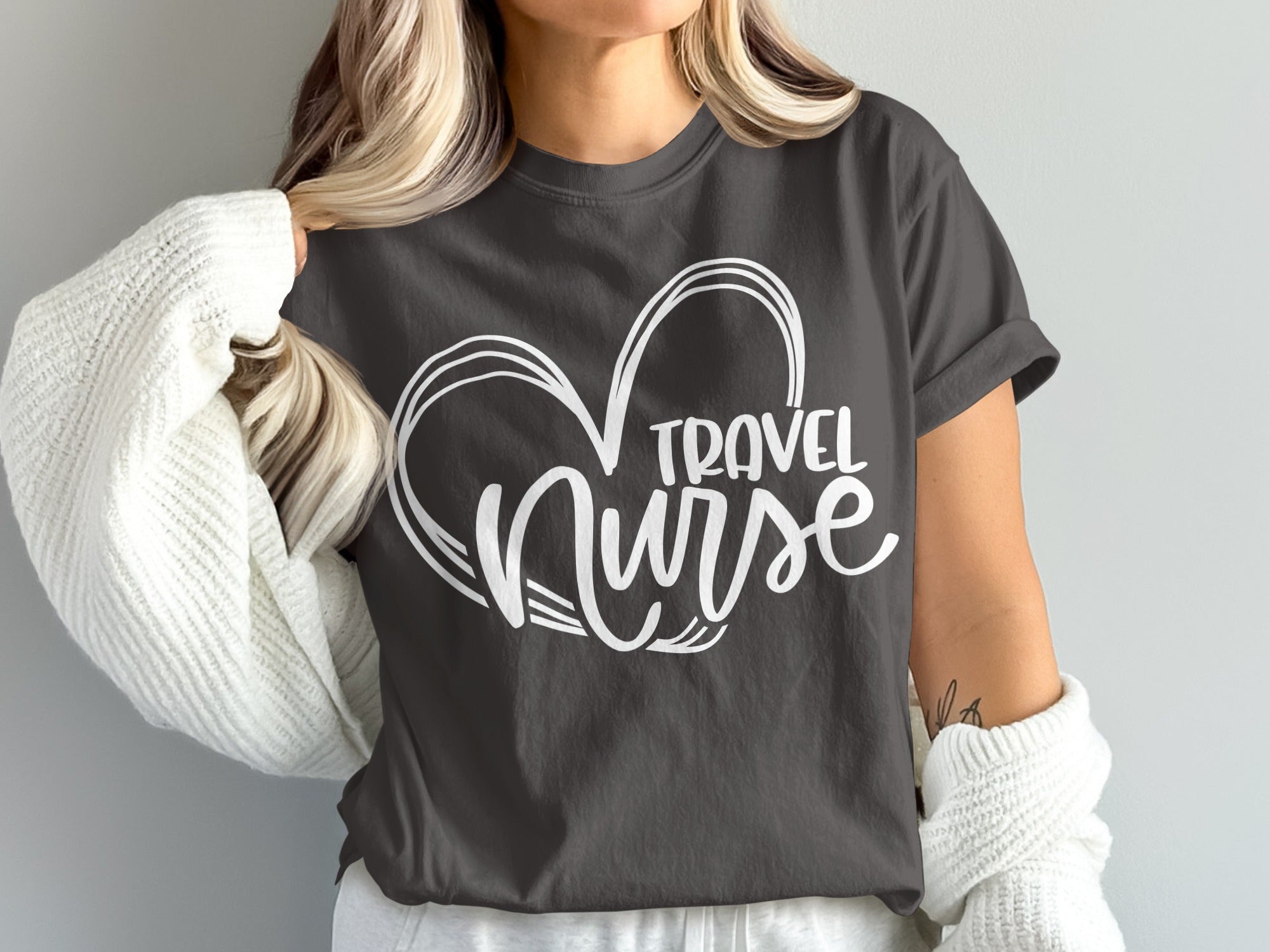 Dark gray t-shirt with white "Travel Nurse" heart graphic.