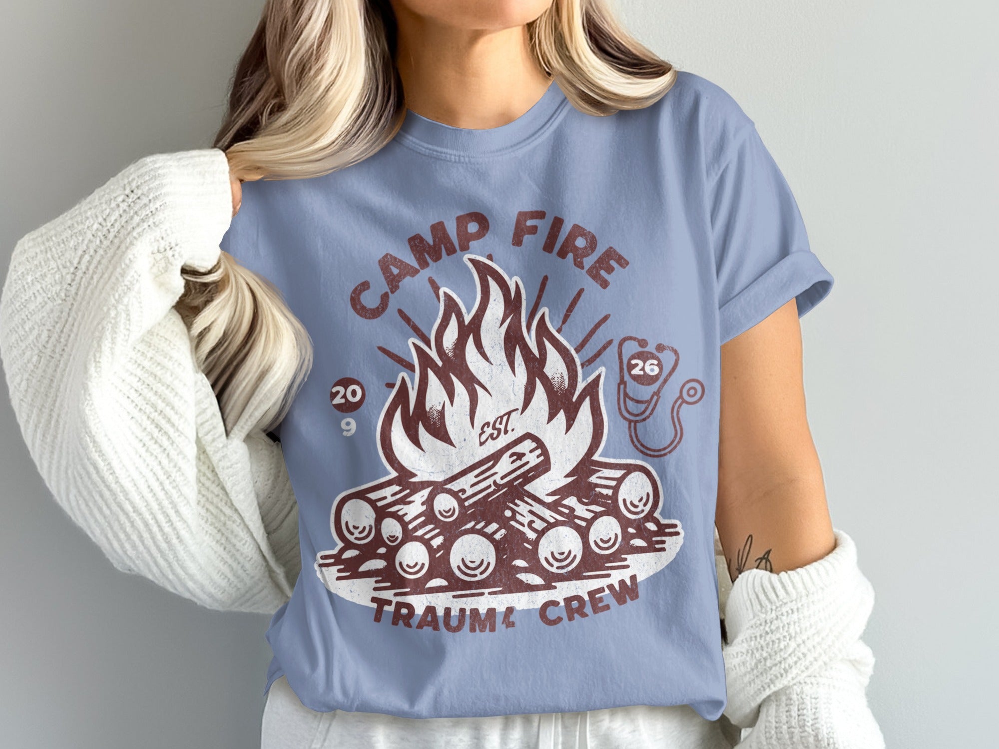 Camp Fire Trauma Crew t-shirt with bonfire and stethoscope graphic.