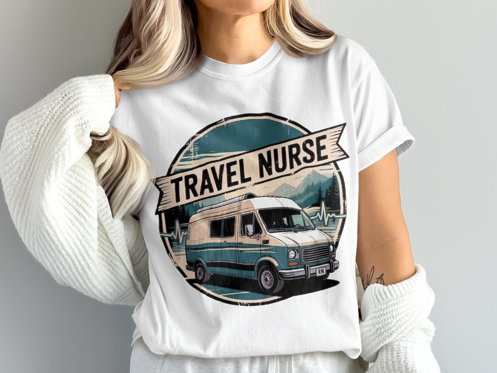 Travel nurse graphic on white t-shirt featuring a retro camper van and mountains.