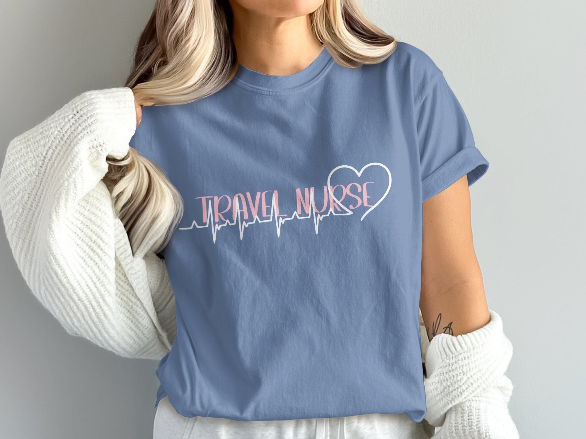 Blue t-shirt with "TRAVEL NURSE" and a heart with a heartbeat line.