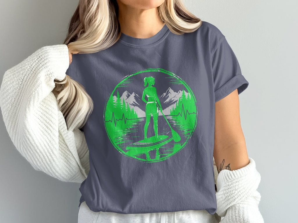 Green circle graphic of paddleboarder with mountains and water on a gray t-shirt.