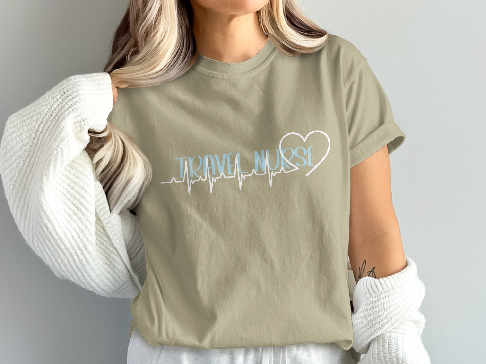Tan t-shirt with "Travel Nurse" text and a heartbeat line with heart.