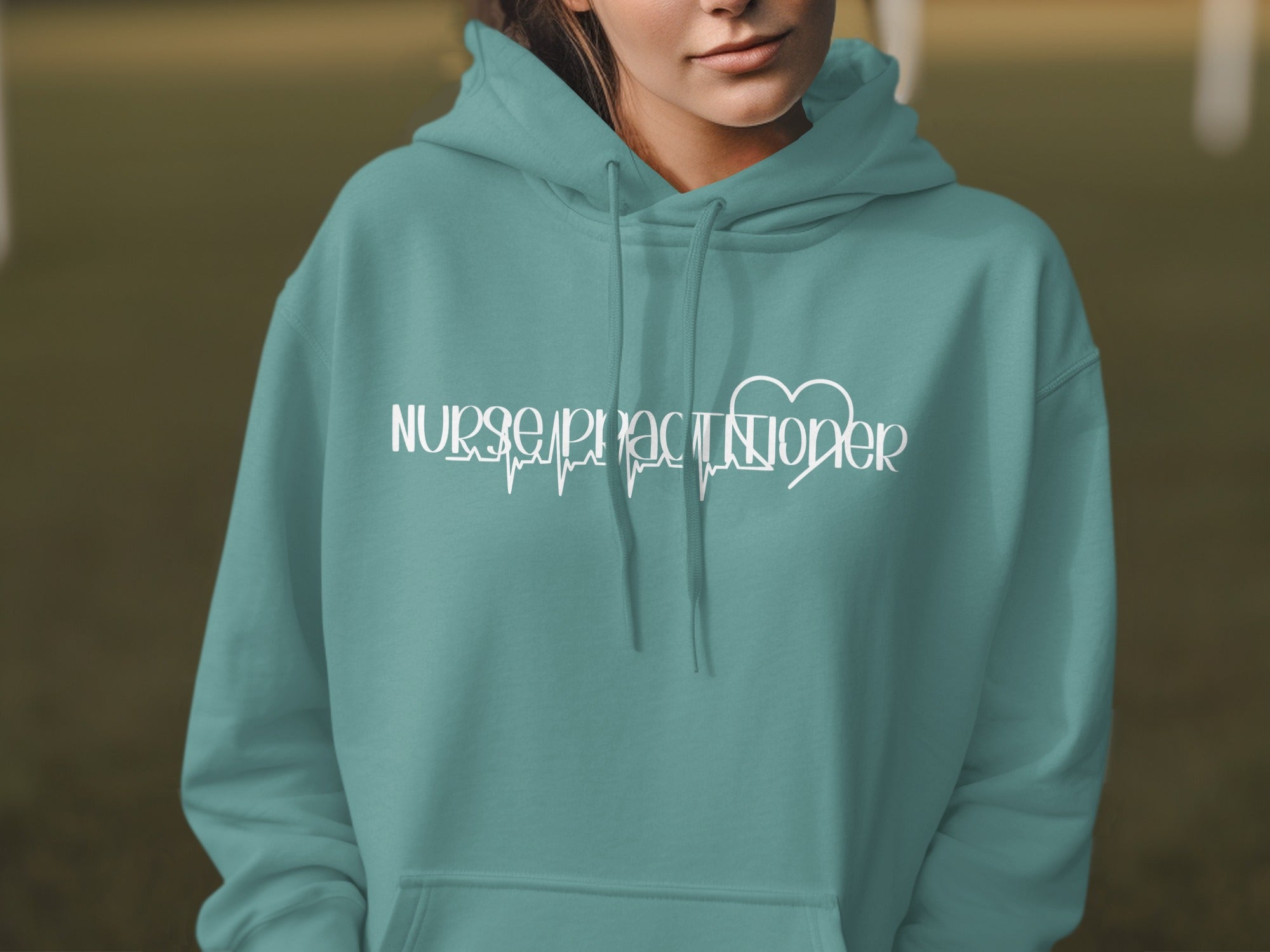 Teal hoodie with "Nurse Practitioner" text and EKG line design.