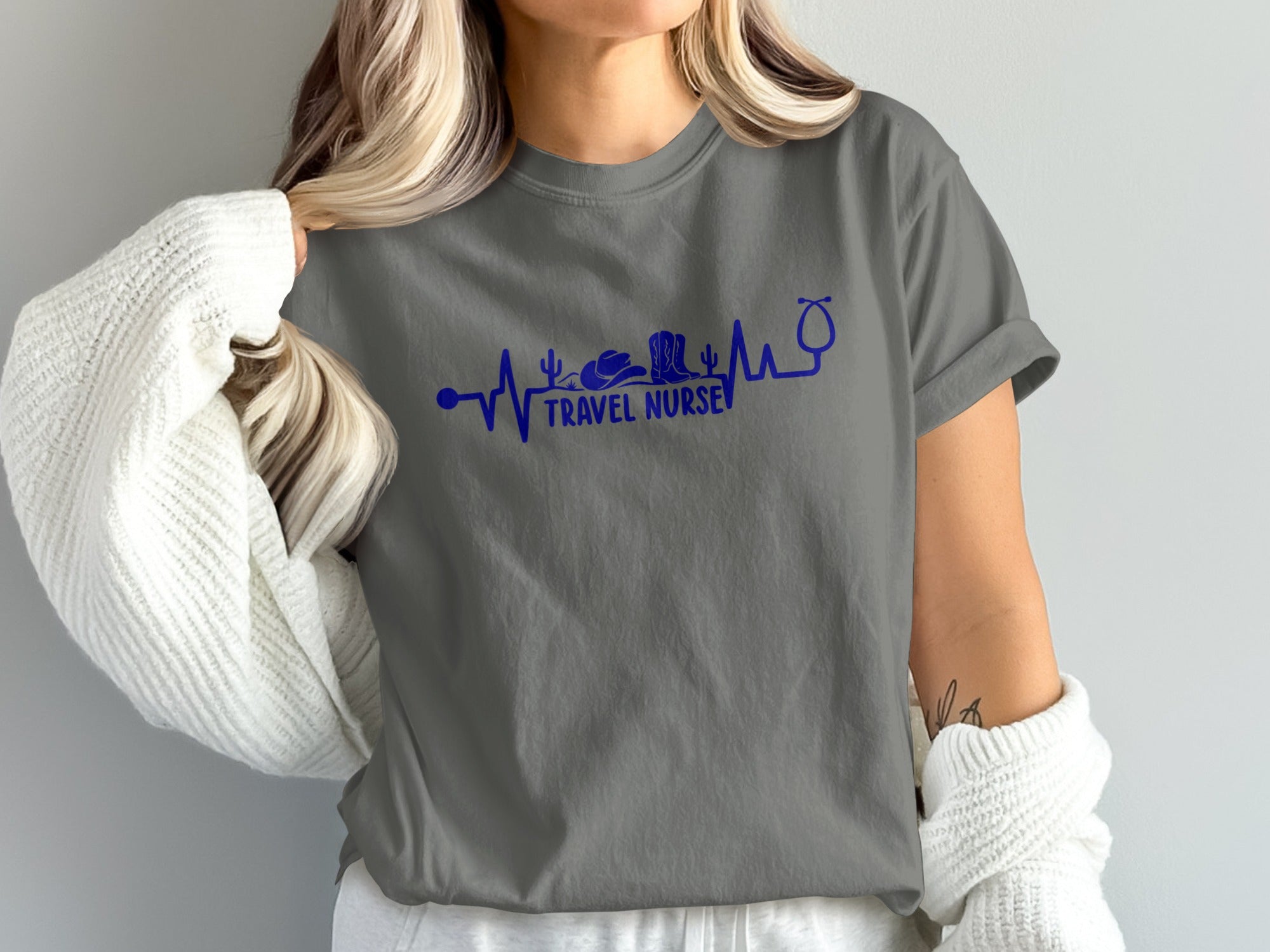 Gray t-shirt with "Travel Nurse" text and heartbeat, cowboy boot, and cactus graphic.