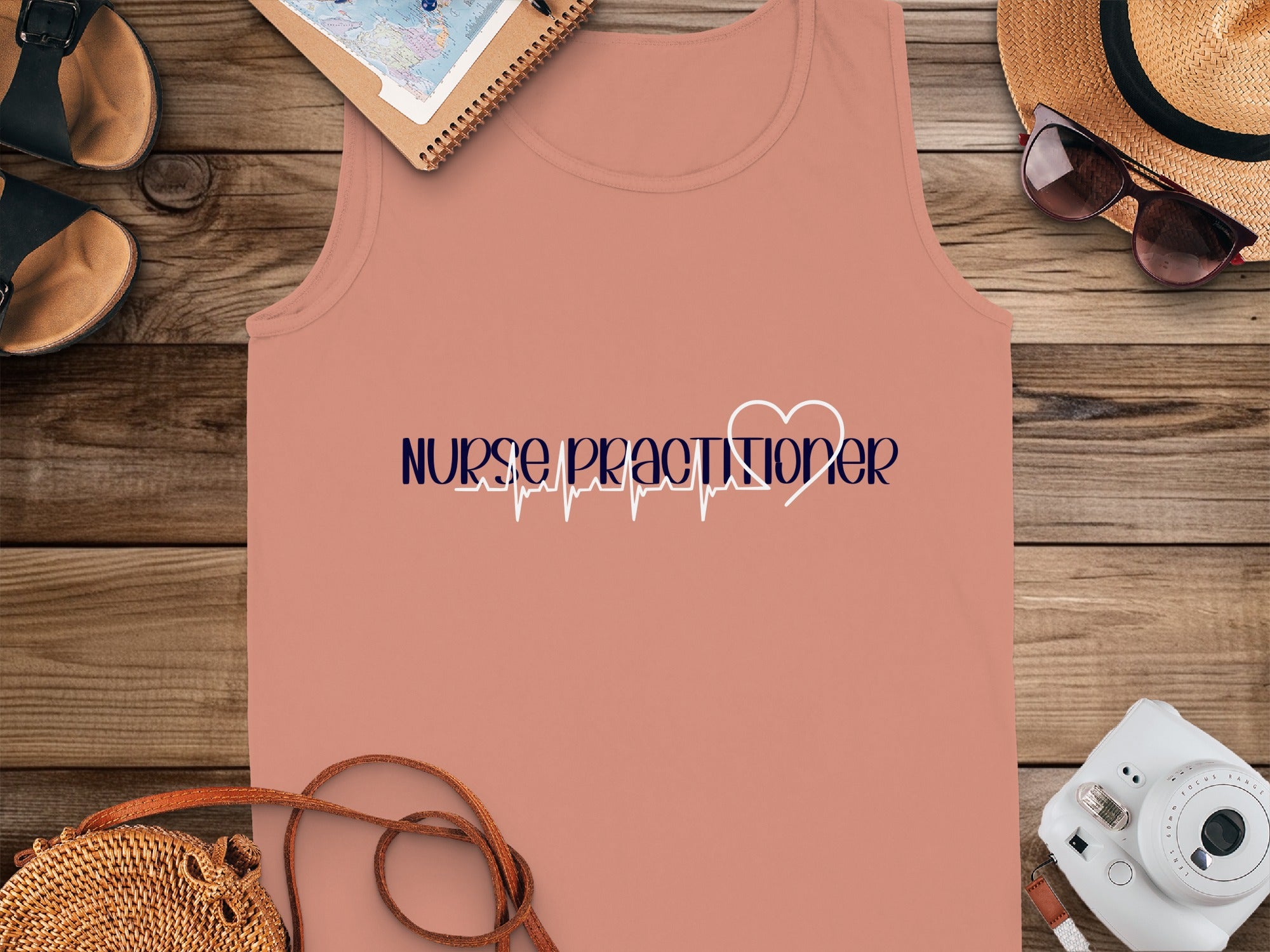 Nurse Practitioner text with a heartbeat graphic on a peach tank top.