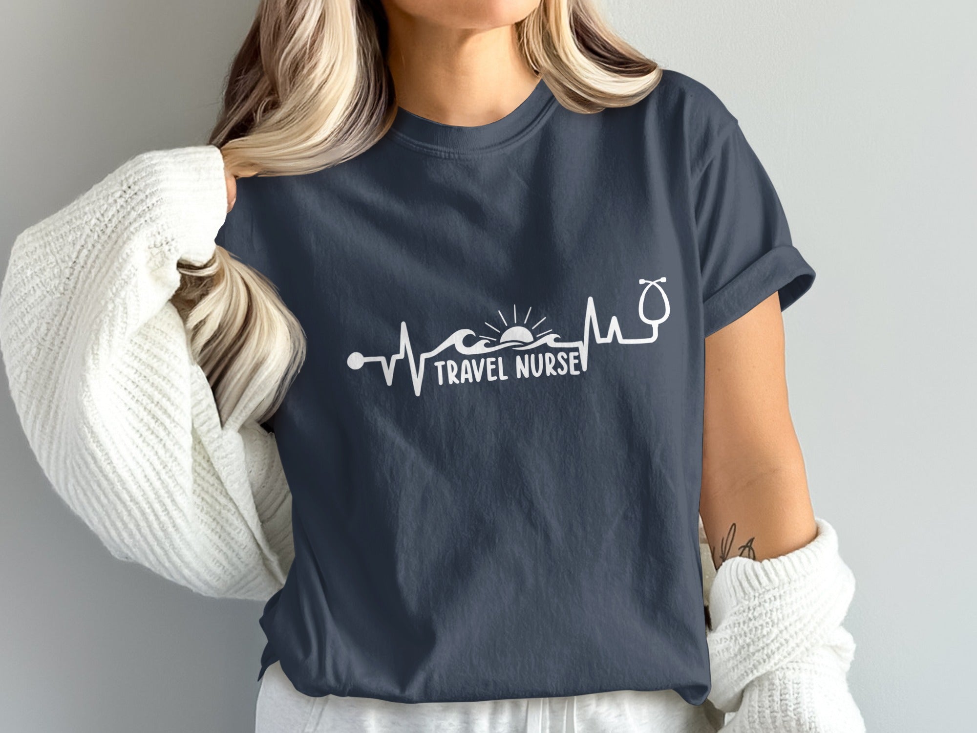 Dark blue t-shirt with "Travel Nurse" text and heartbeat graphic.