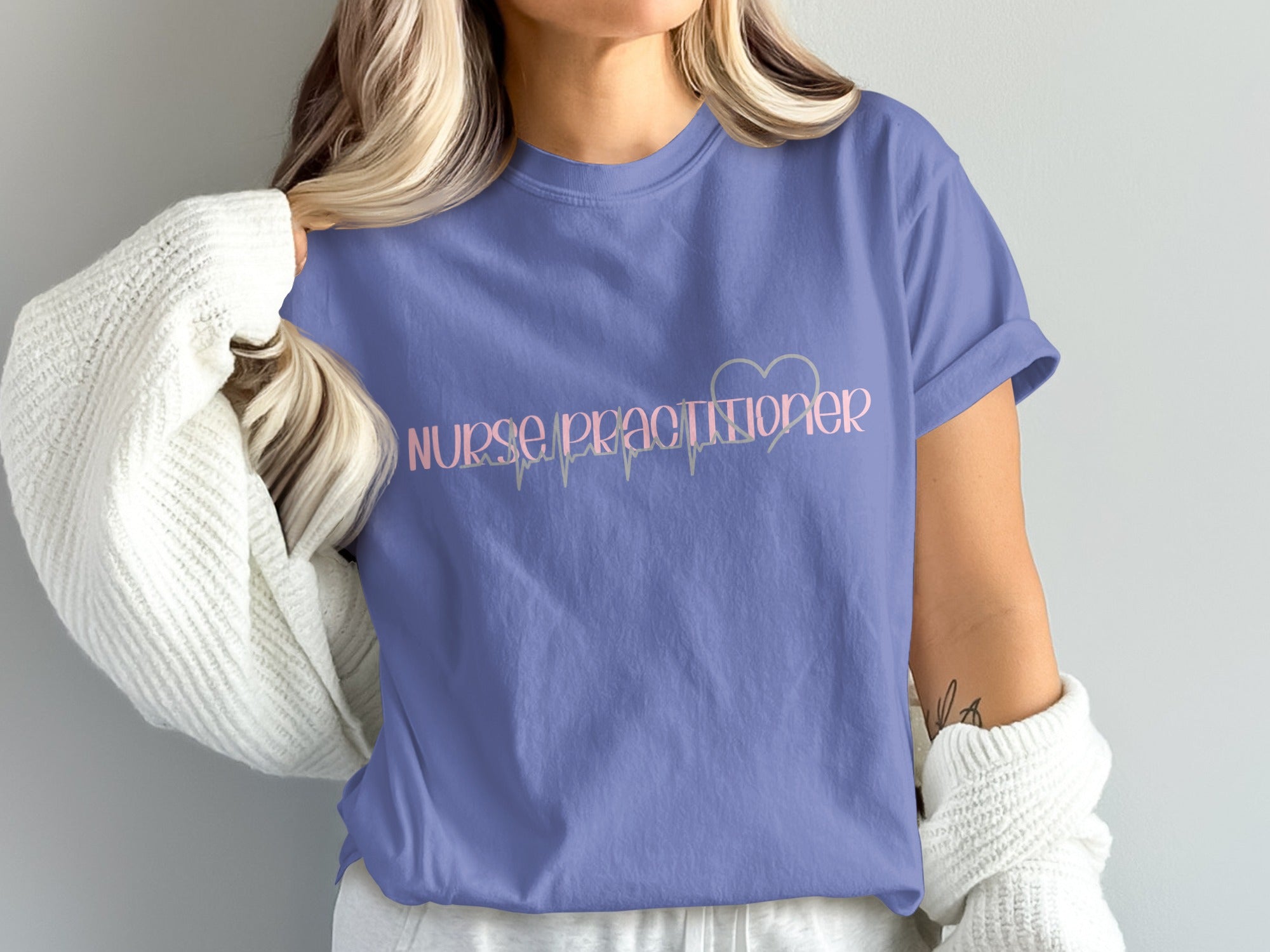 Purple t-shirt with "Nurse Practitioner" and heart monitor design.