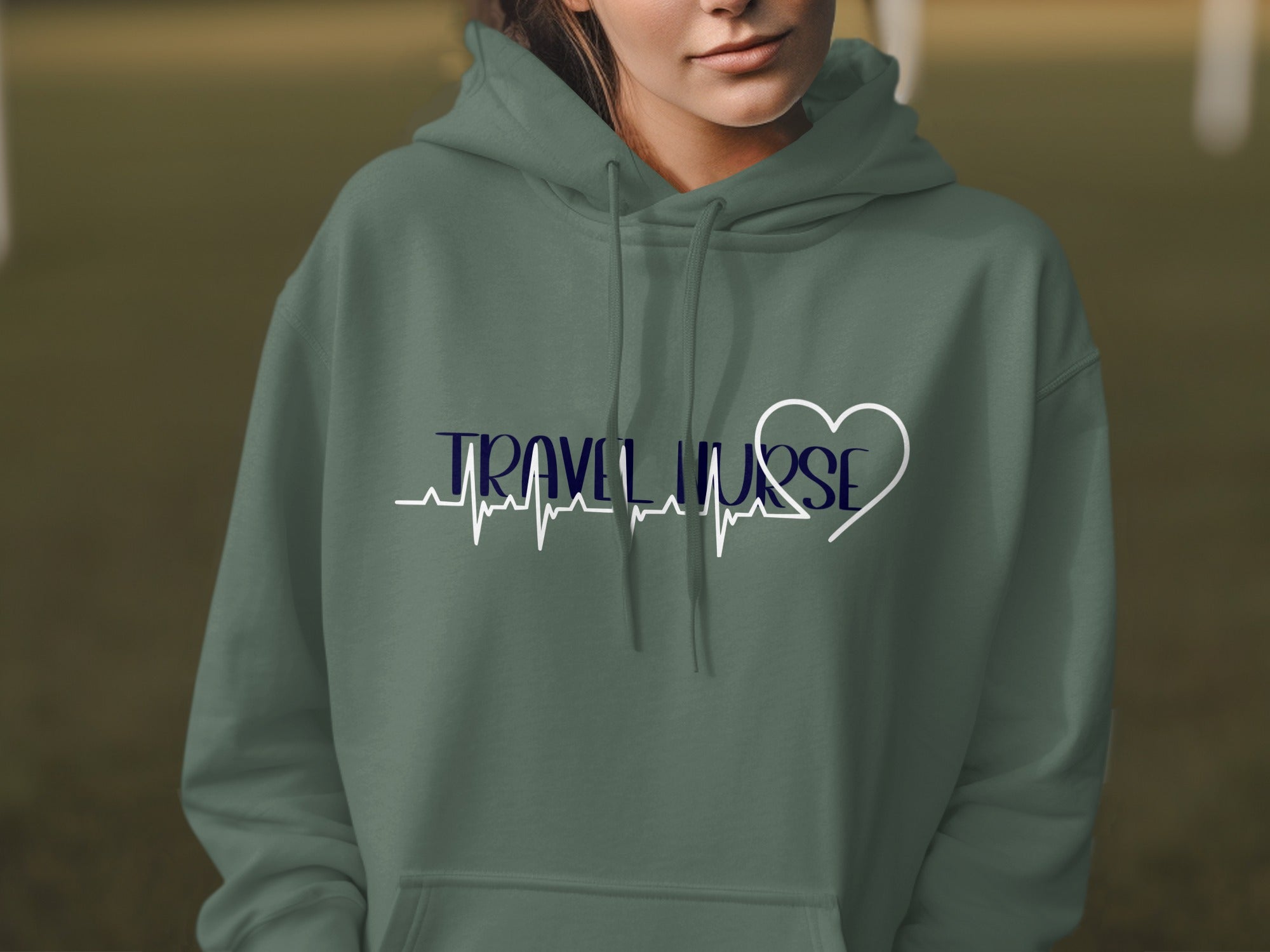 Green hoodie with "TRAVEL NURSE" and a heartbeat line with a heart.