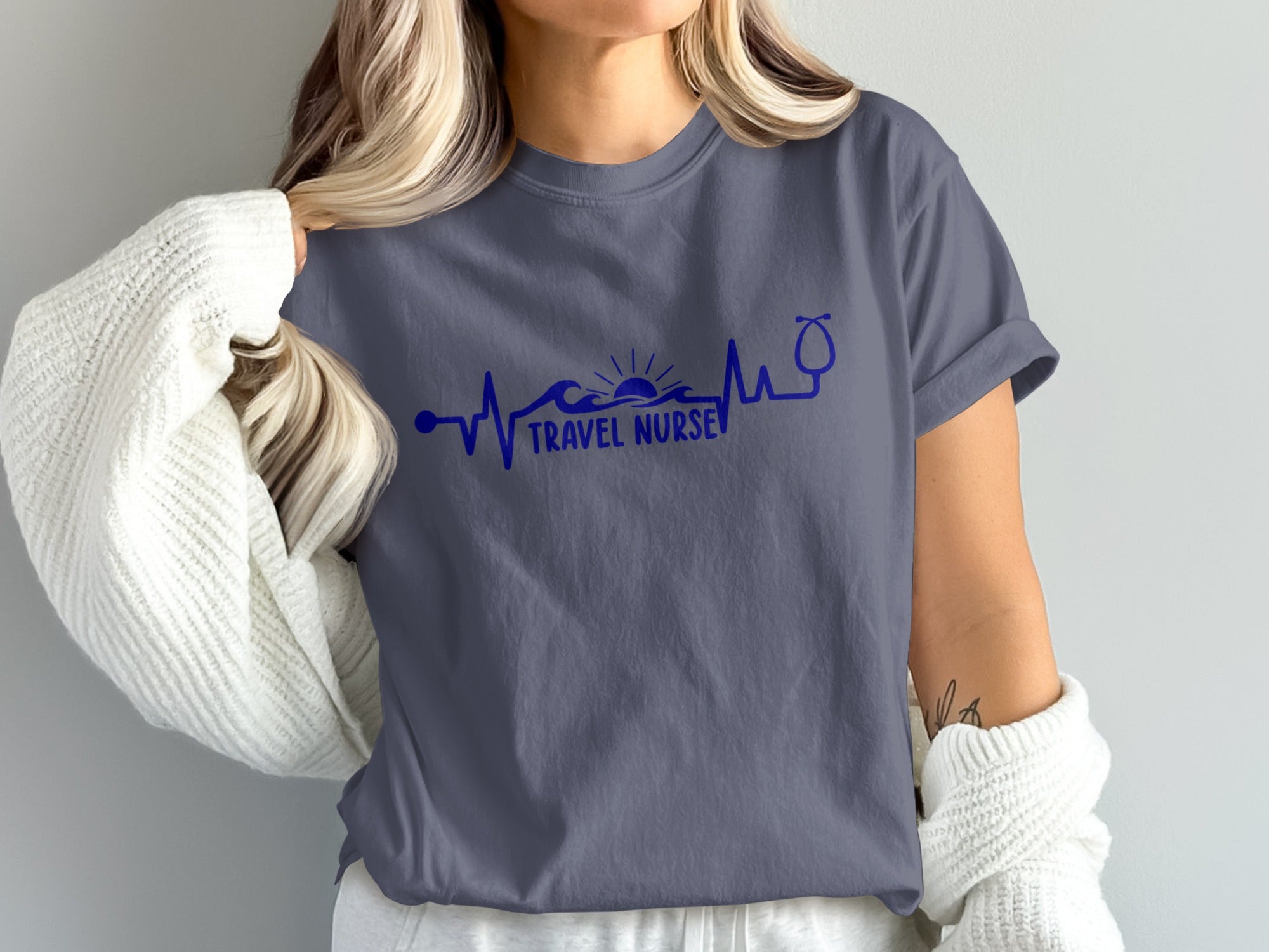 Navy blue t-shirt with travel nurse graphic featuring a heartbeat line and stethoscope.