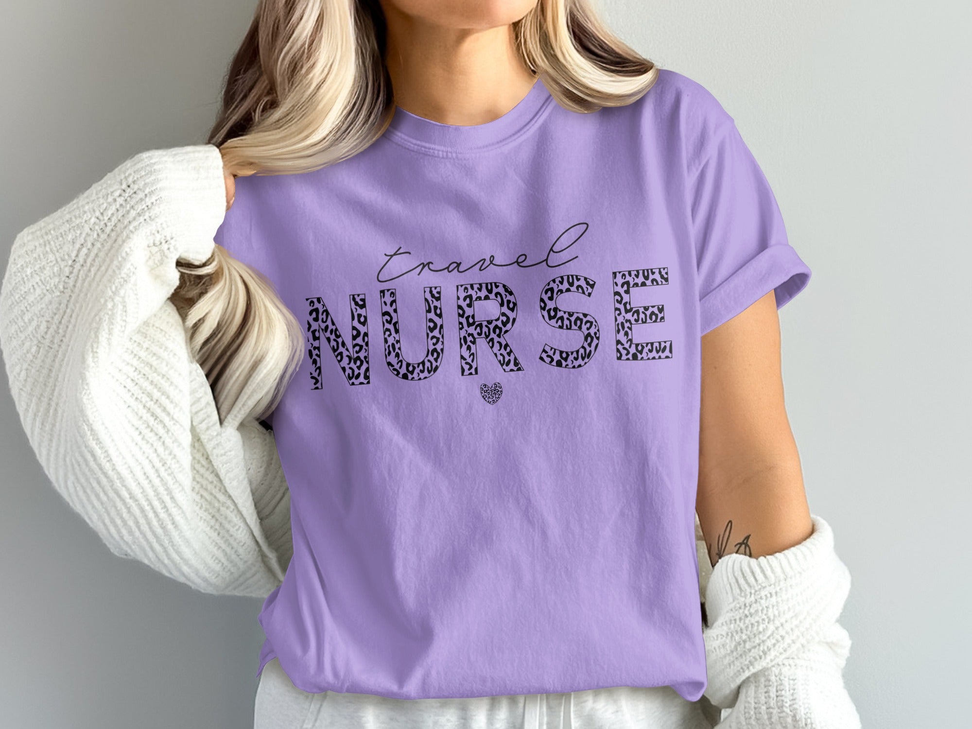 Purple t-shirt with "travel NURSE" text in leopard print and a small heart.