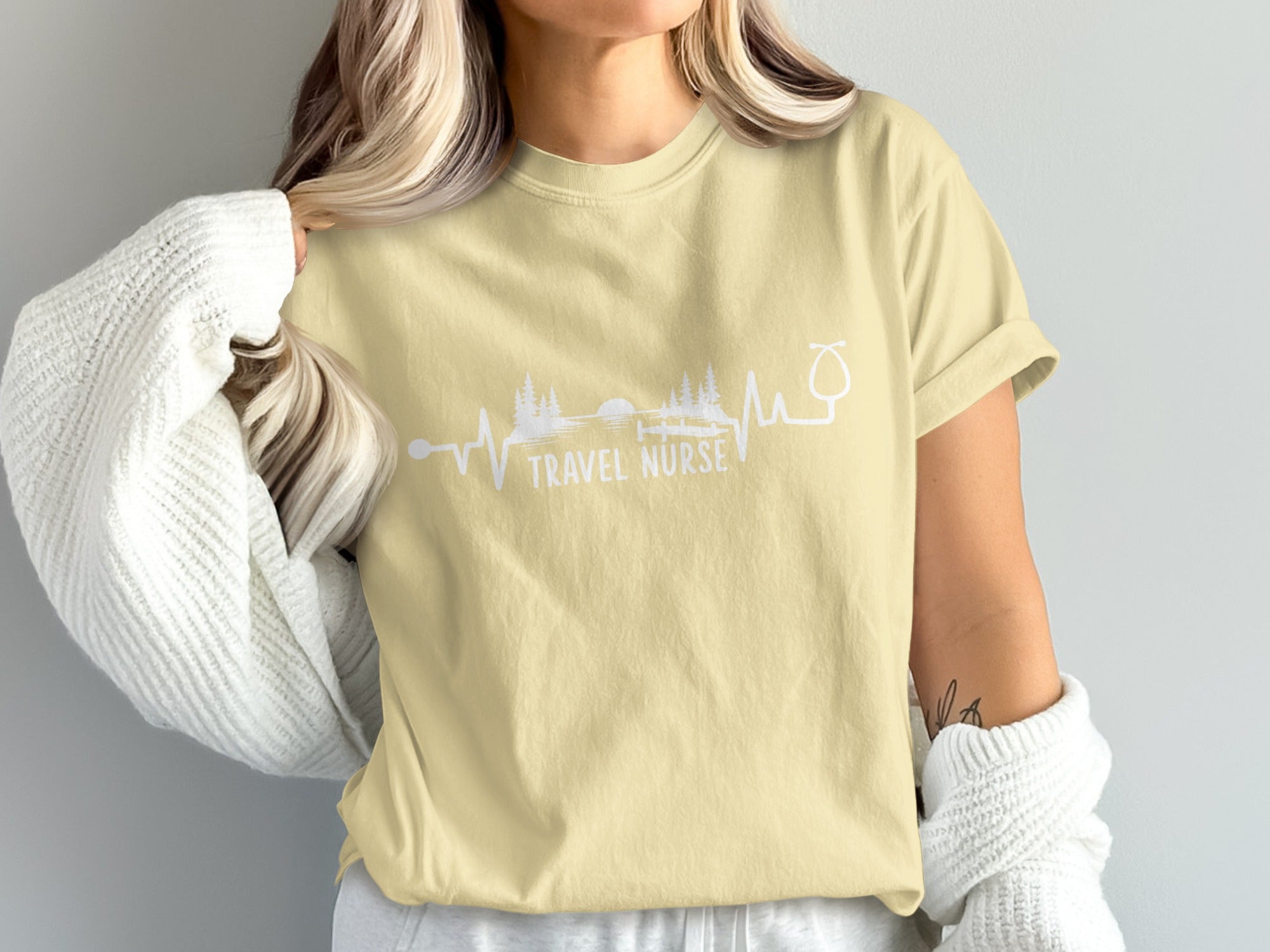 T-shirt with "TRAVEL NURSE" text and stethoscope heartbeat graphic.