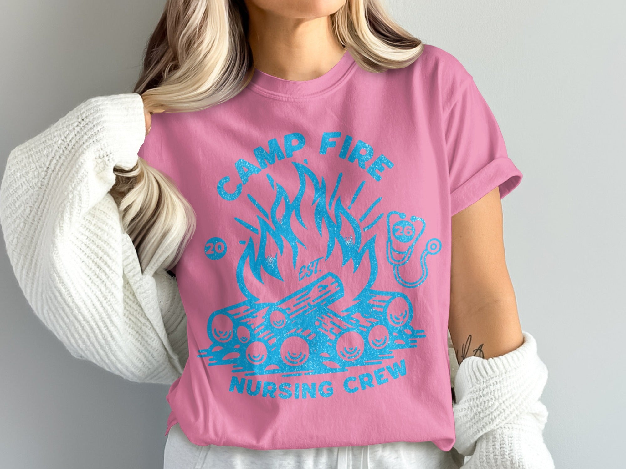 Pink t-shirt with "Camp Fire Nursing Crew" and blue flame graphics.