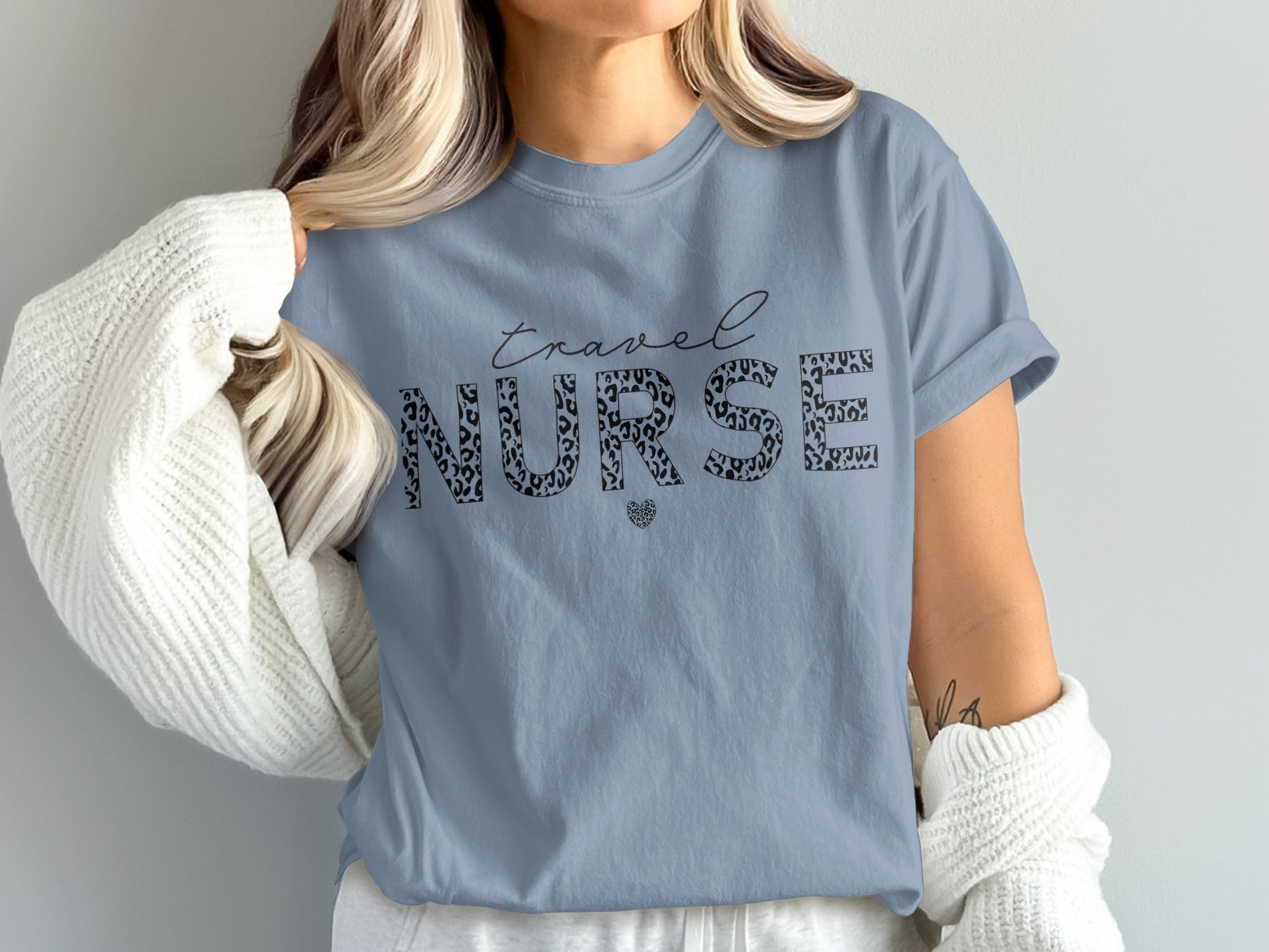 Blue t-shirt with "travel NURSE" text and leopard print heart.
