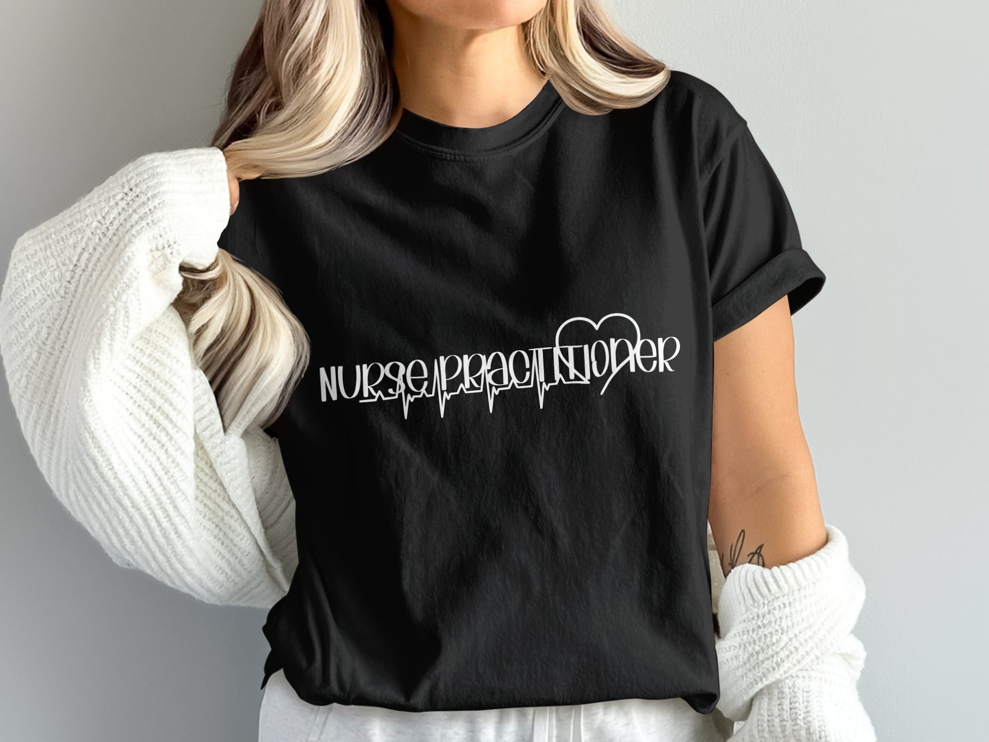 Black t-shirt with "Nurse Practitioner" and heartbeat graphic.
