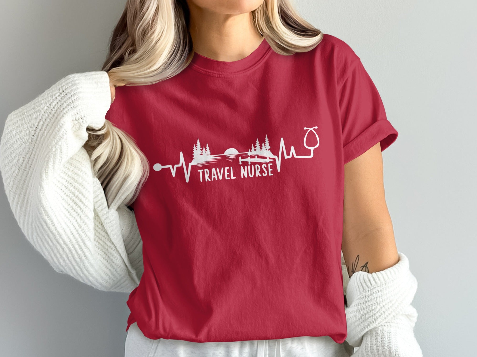 Red t-shirt with "TRAVEL NURSE" text and heartbeat graphic.