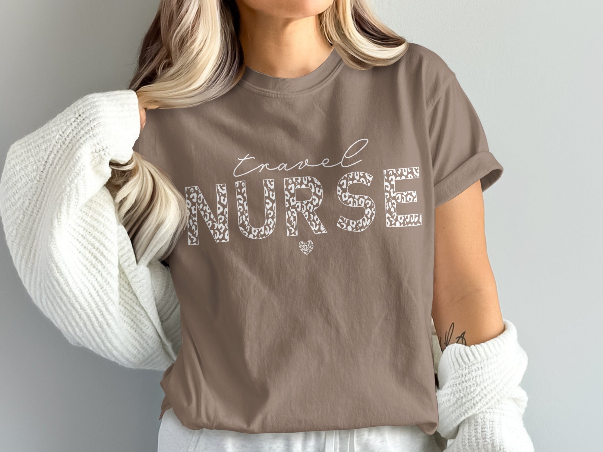 Brown t-shirt with "Travel Nurse" text and leopard print lettering.