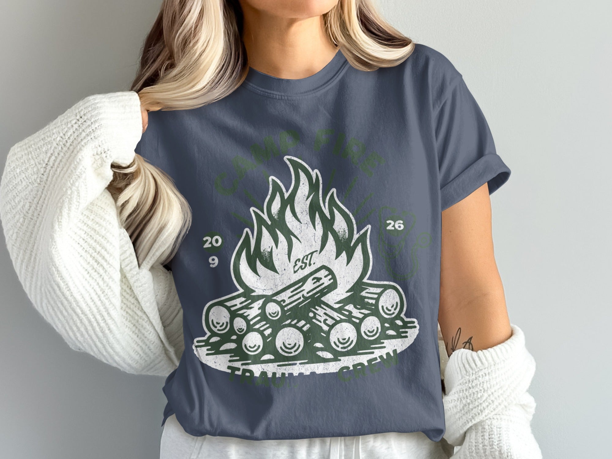 Graphic t-shirt with a campfire design and "Camp Life" text.