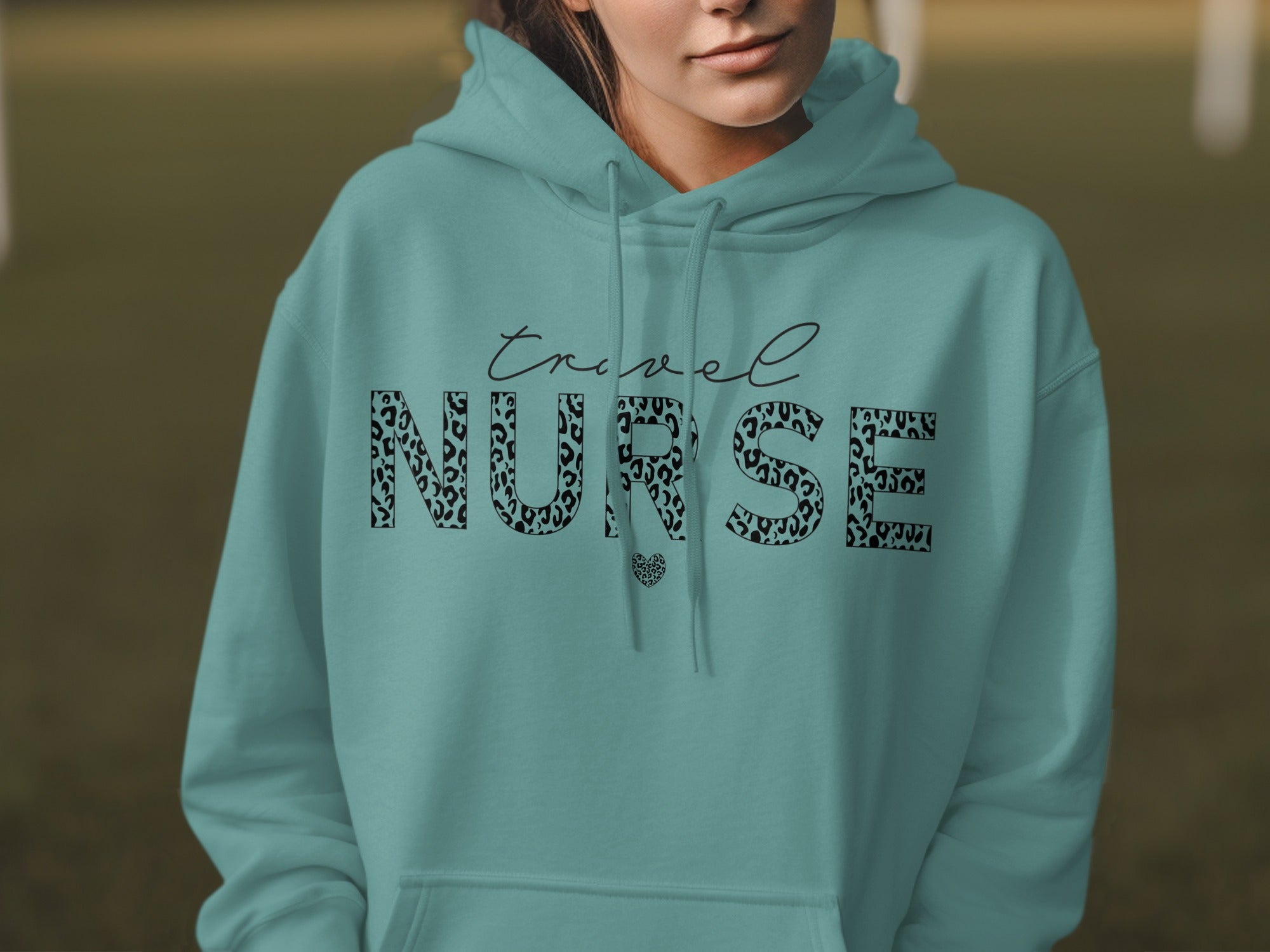Teal hoodie with "Travel Nurse" text in leopard print.