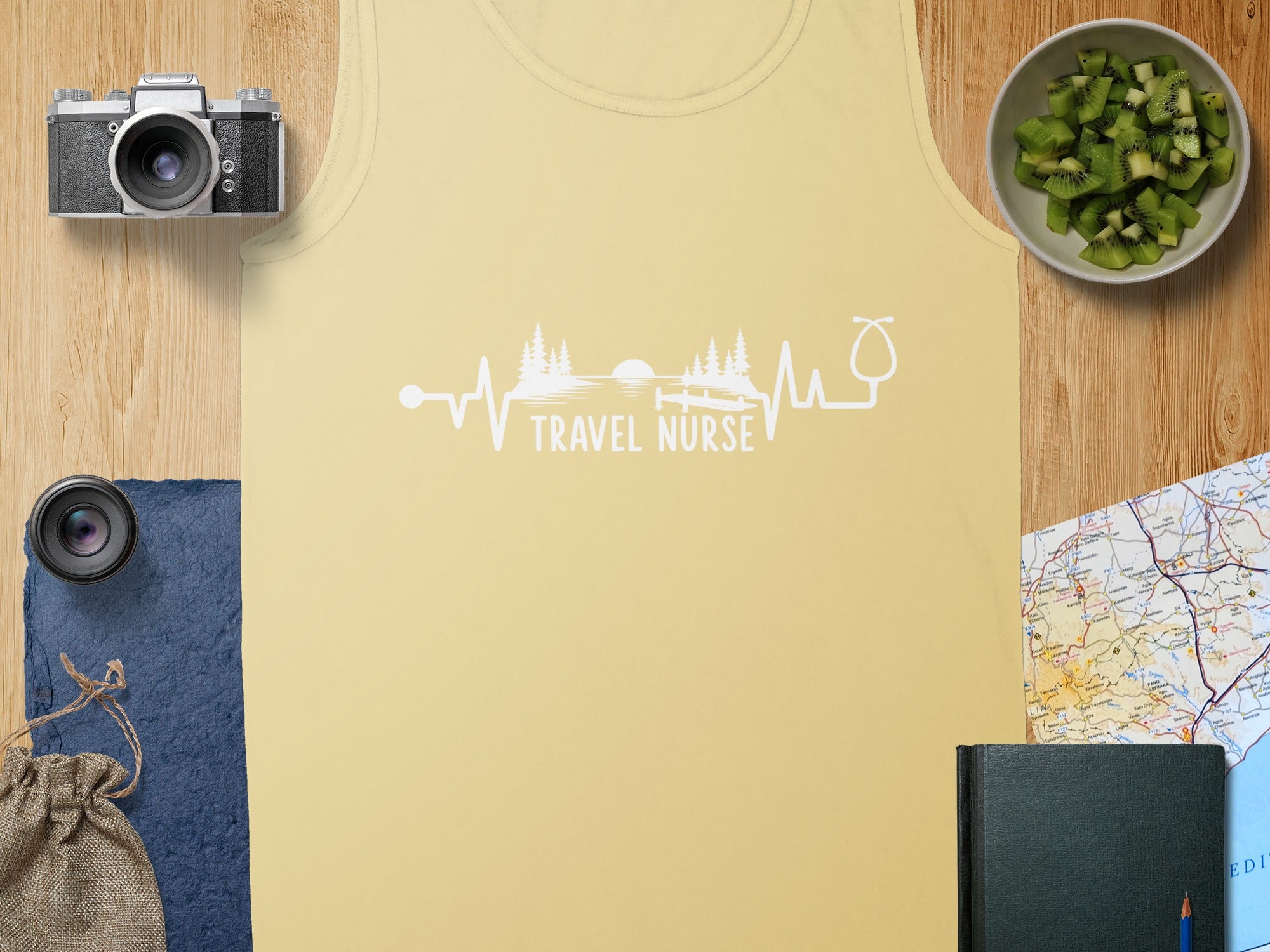 Yellow tank top with "Travel Nurse" text overlayed on a heart rate and stethoscope graphic.