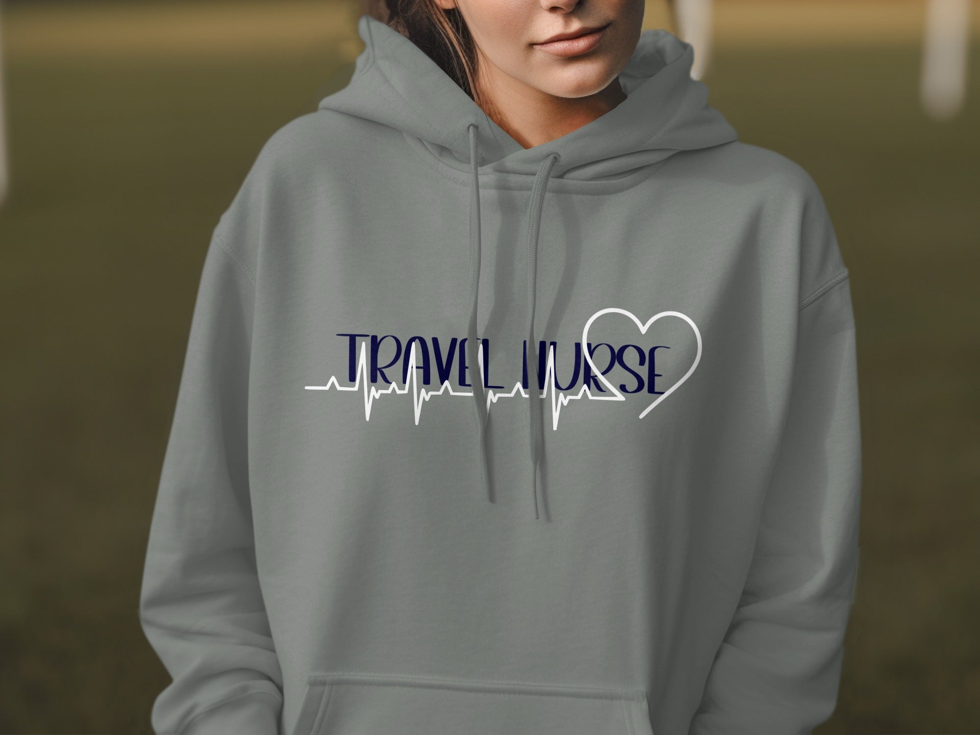 Grey hoodie with "Travel Nurse" text and a heartbeat graphic.