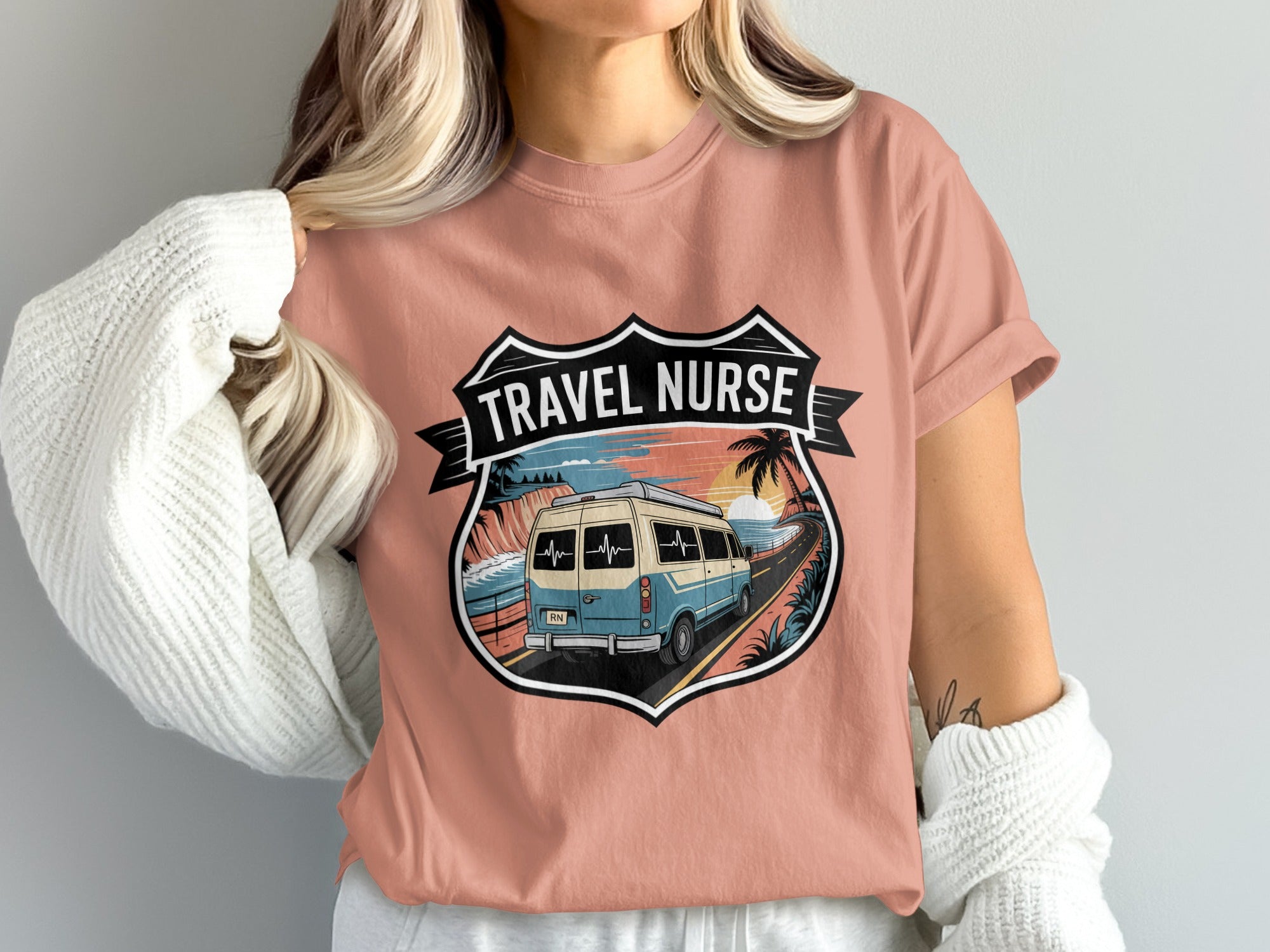 Retro van driving down coastal road with "Travel Nurse" text on shield.