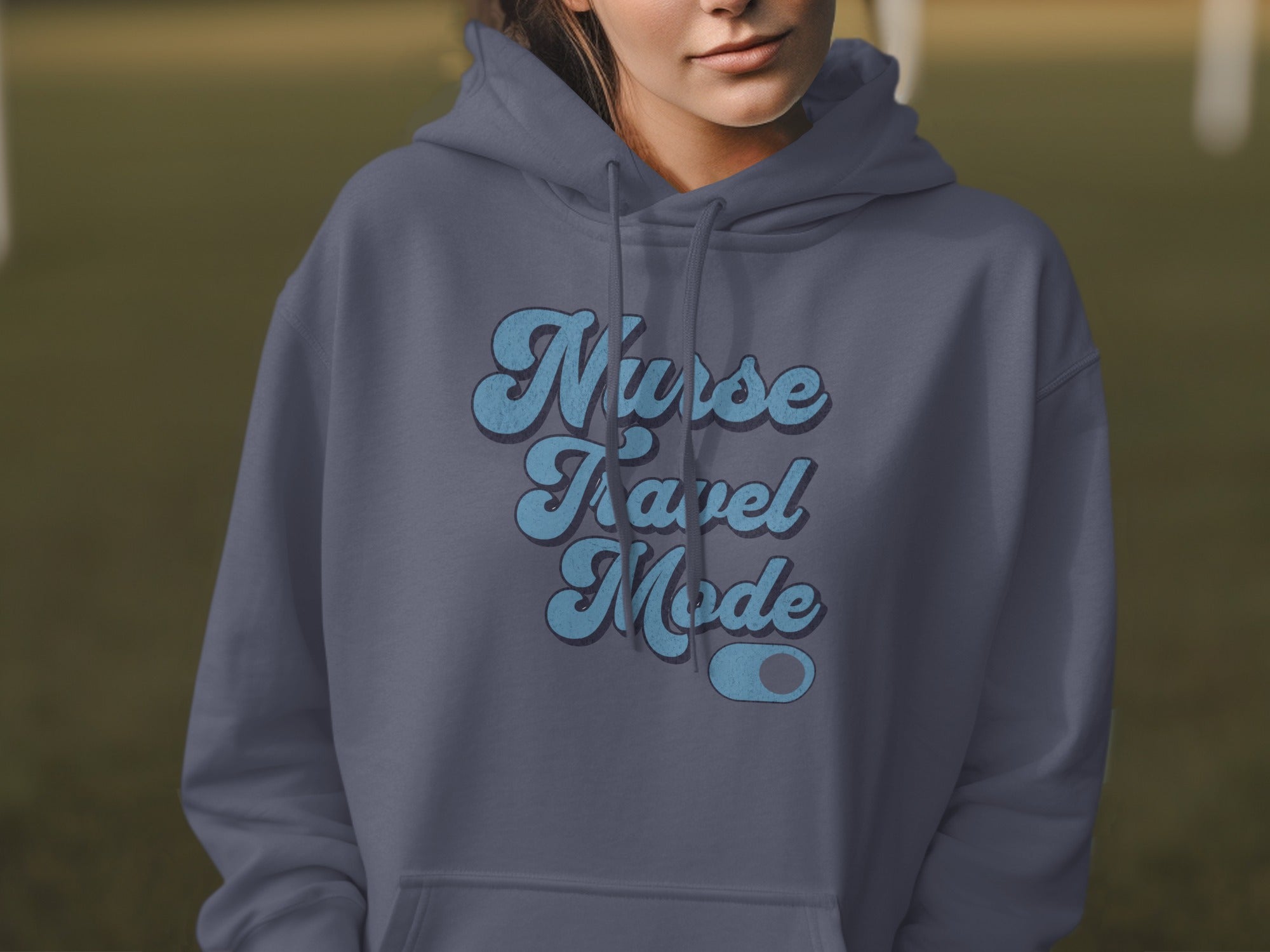Dark grey hoodie with "Nurse Travel Mode" text in blue, distressed font.
