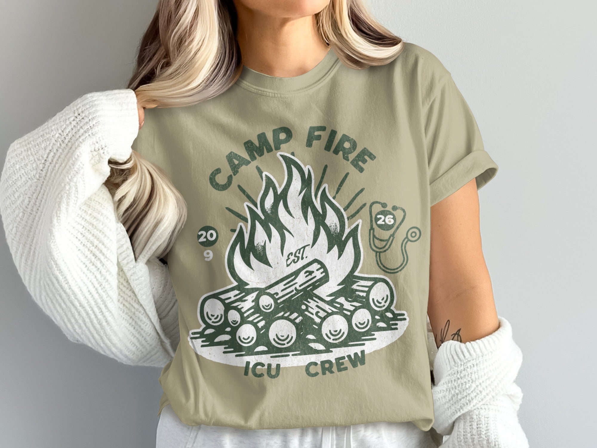 Camp Fire ICU Crew t-shirt with graphic of campfire and stethoscope.