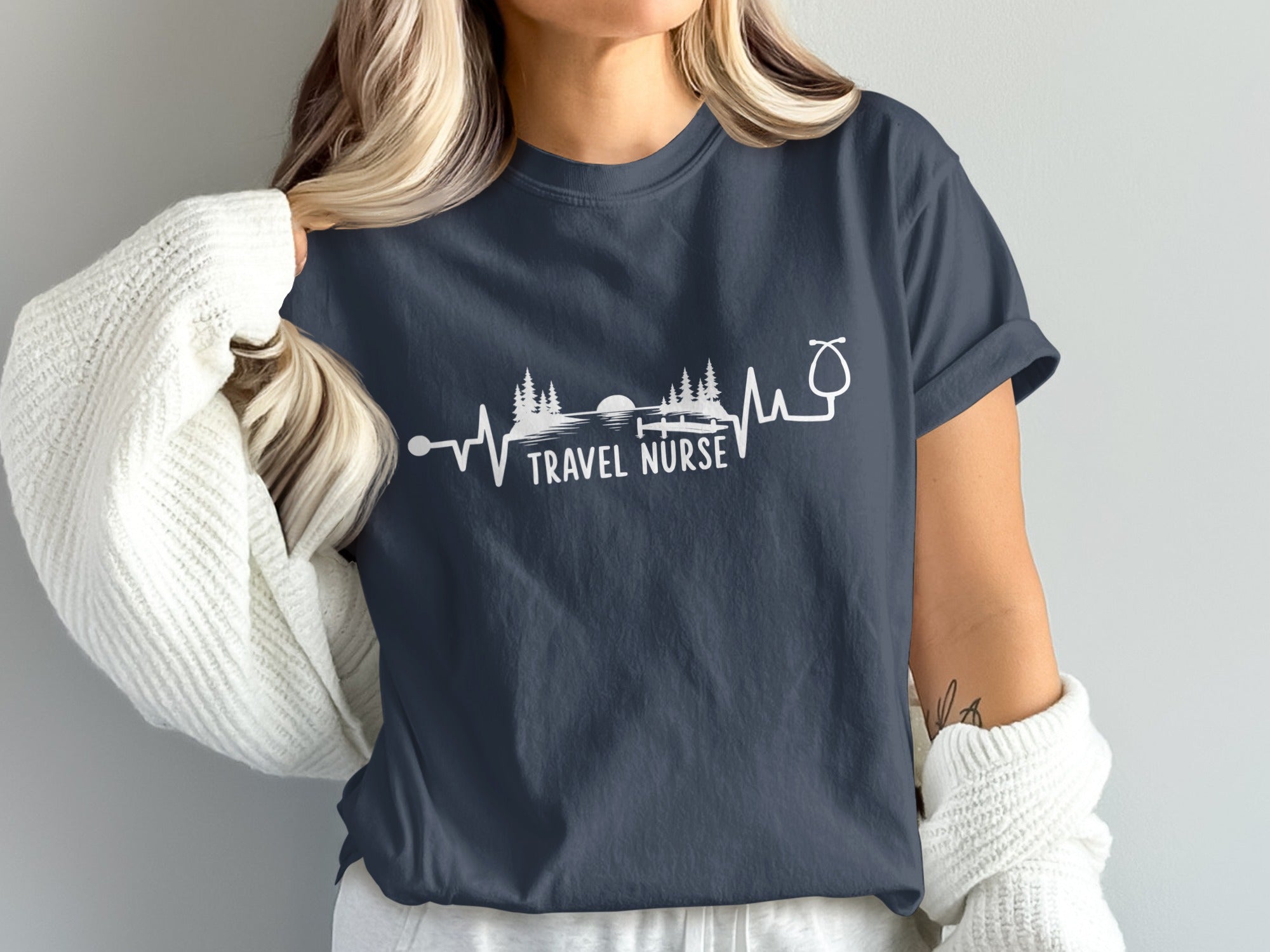 Dark t-shirt with "TRAVEL NURSE" and a heartbeat line graphic.