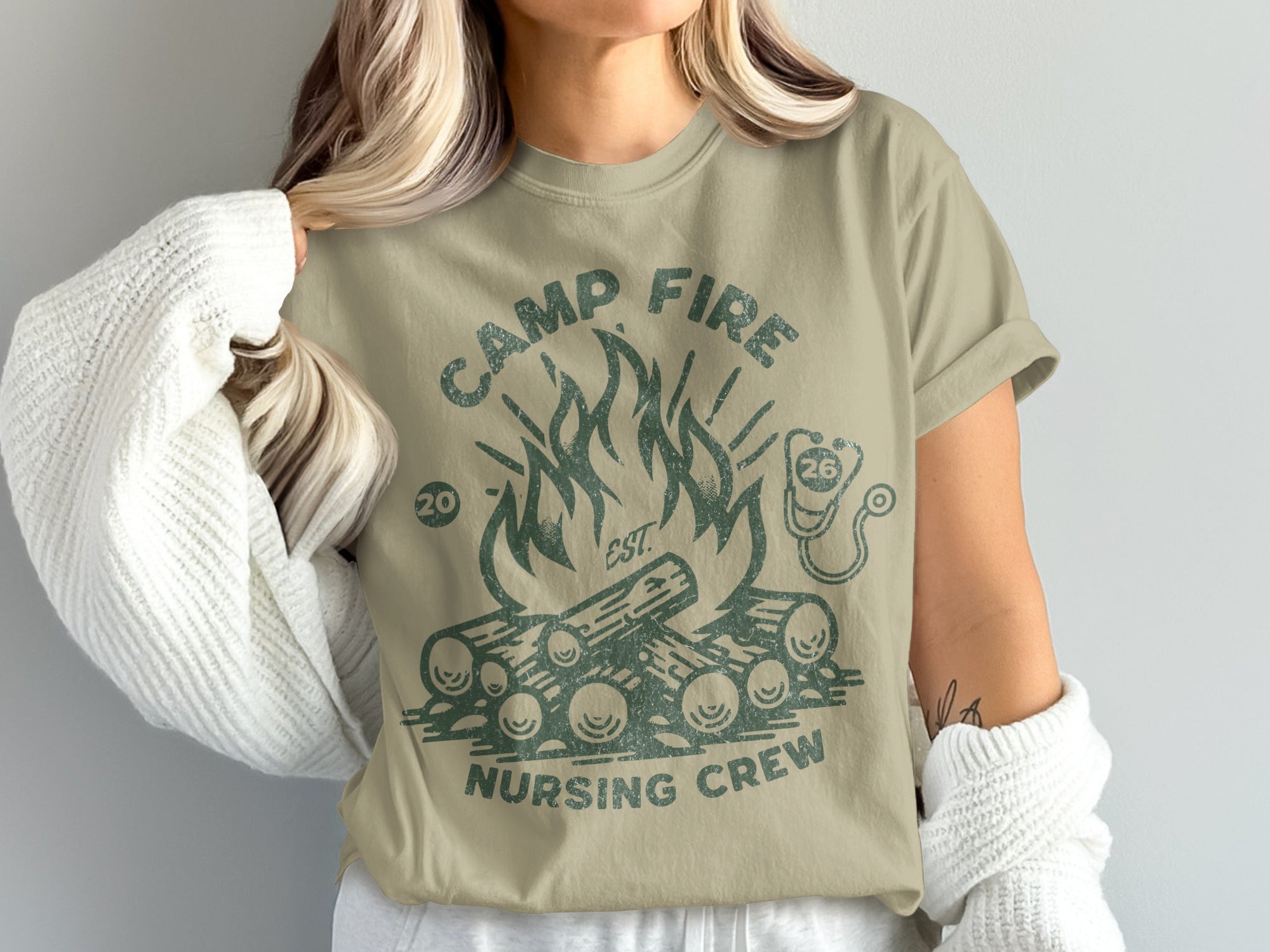Camp Fire Nursing Crew graphic tee with campfire and stethoscope.