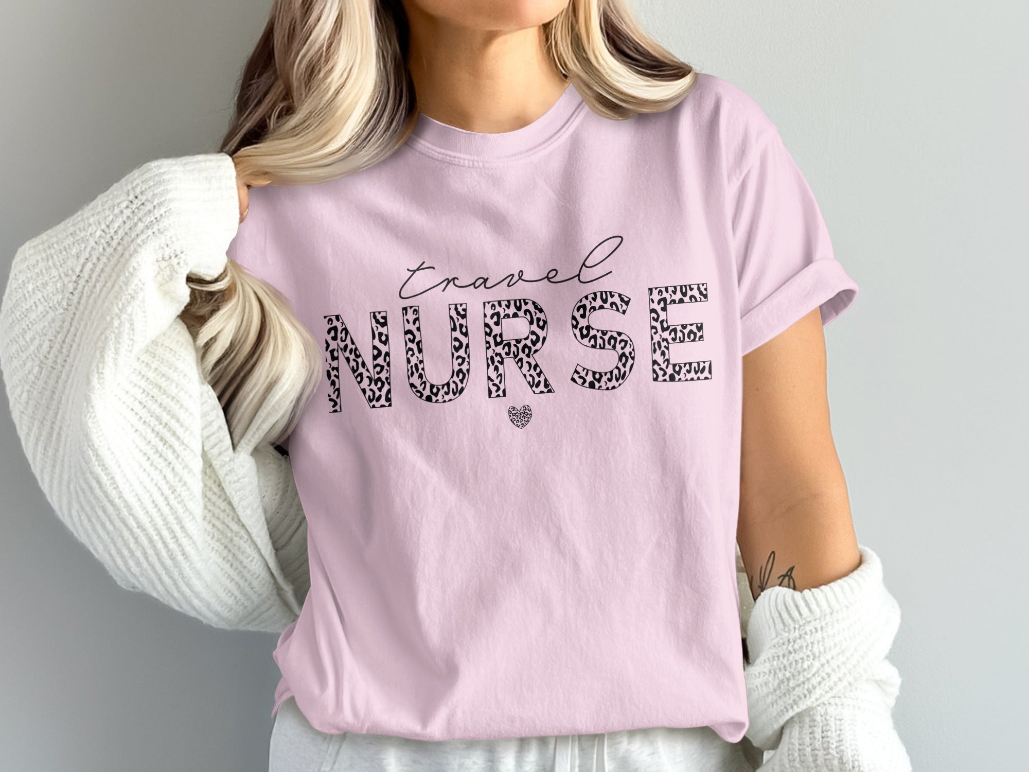 Pink t-shirt with "Travel NURSE" in leopard print and heart.