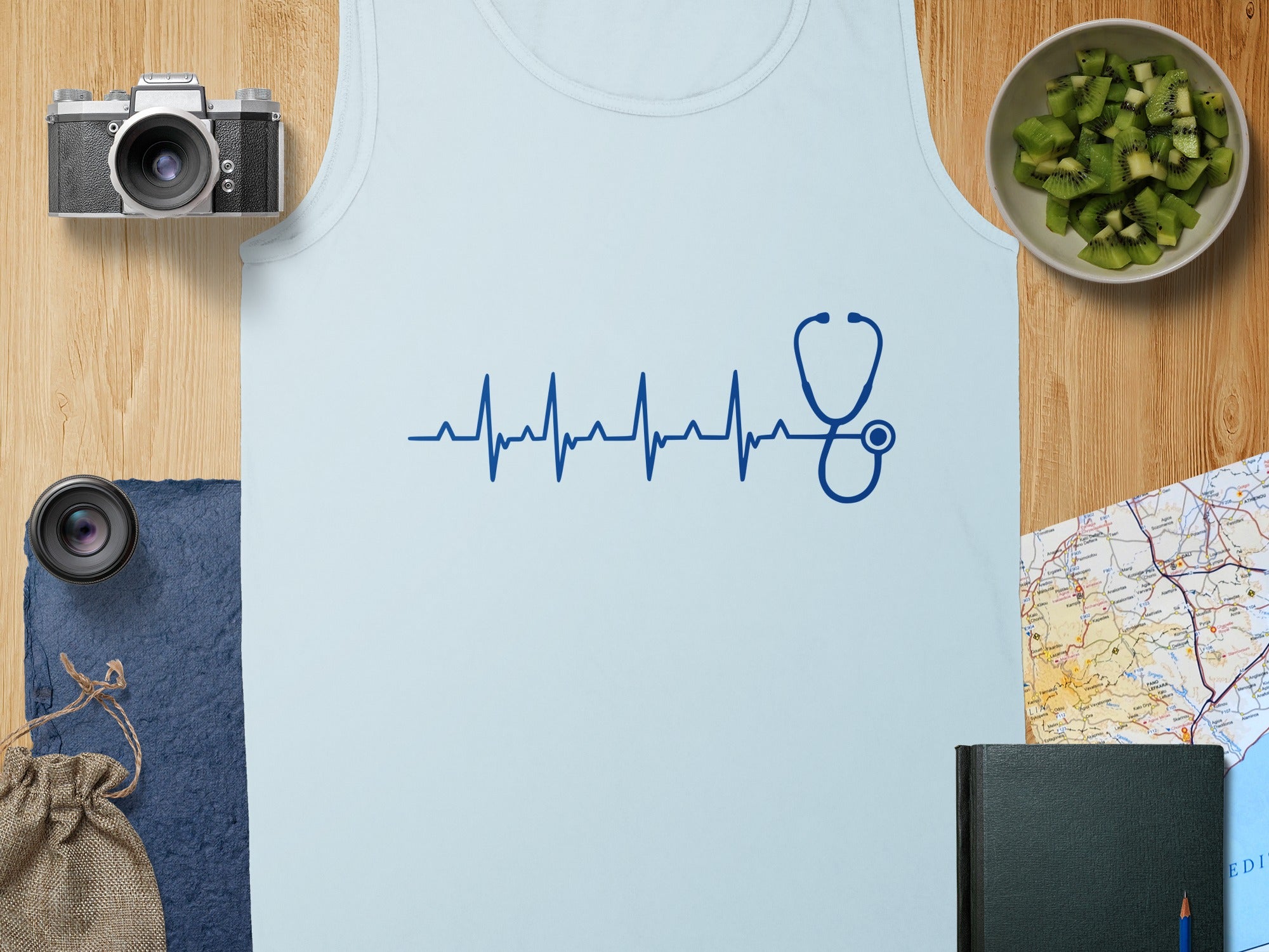 Blue stethoscope heartbeat graphic on a light blue tank top.