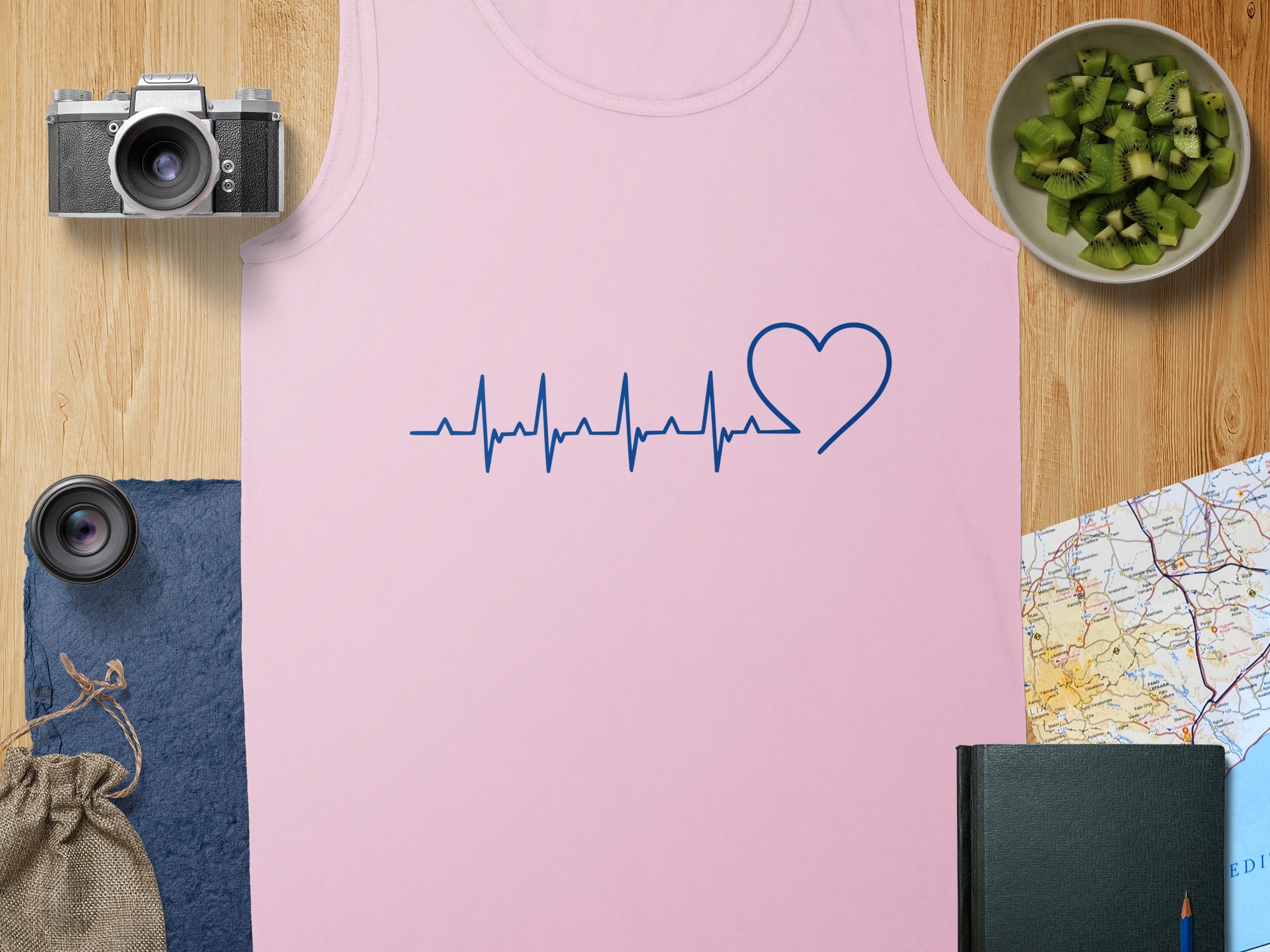 Pink tank top with a blue electrocardiogram and heart graphic.