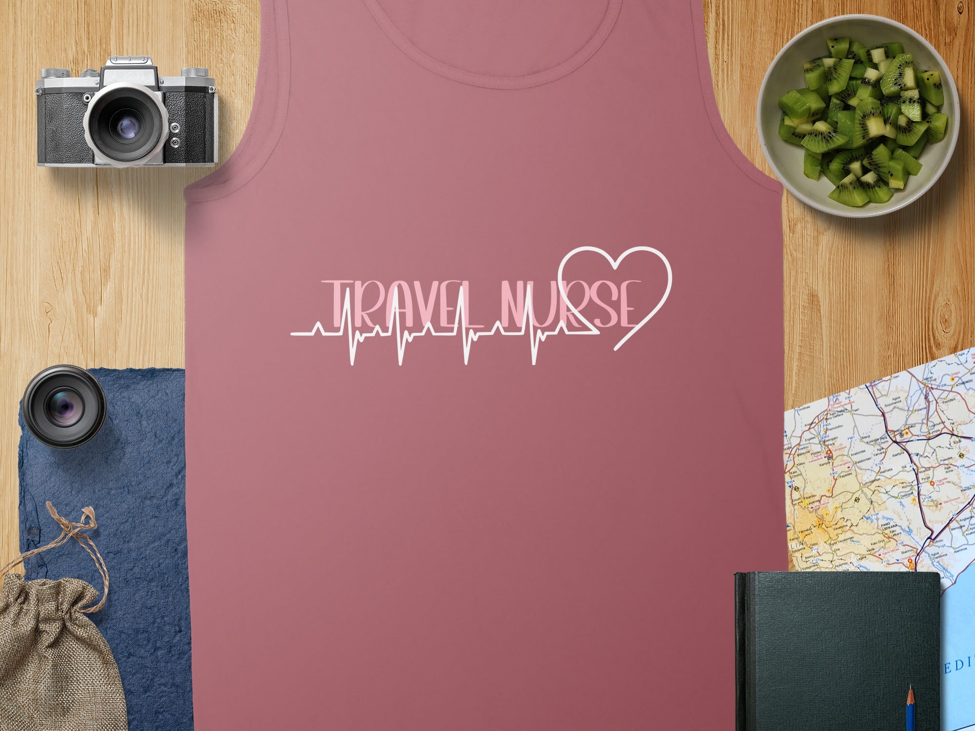 Pink tank top with "TRAVEL NURSE" in a heartbeat graphic.