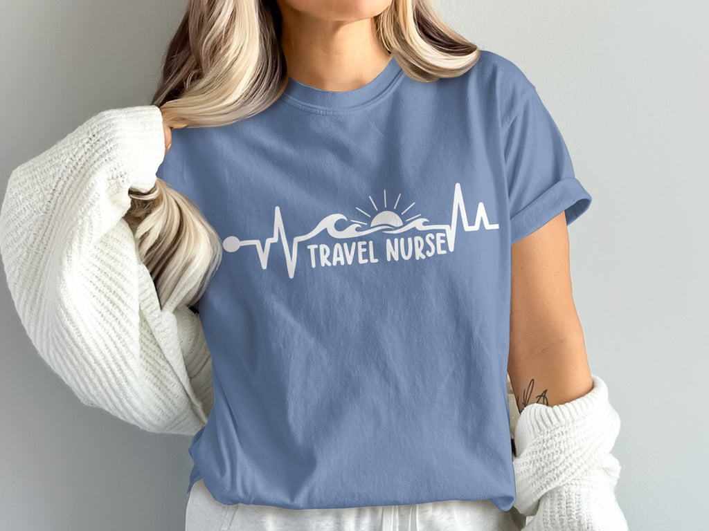 Blue t-shirt with white heartbeat graphic and text "TRAVEL NURSE".