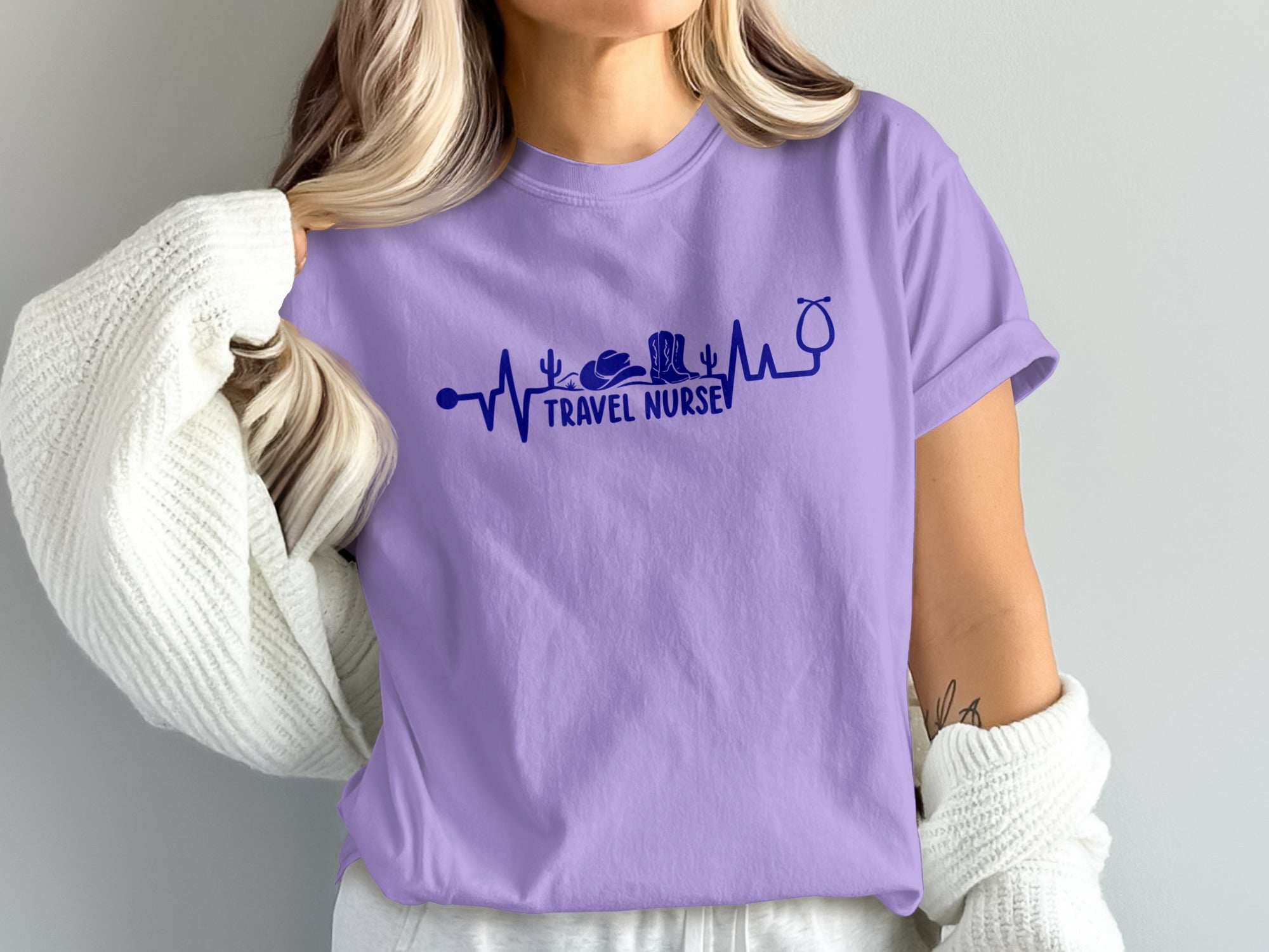 Purple t-shirt with navy blue electrocardiogram and "Travel Nurse" text.