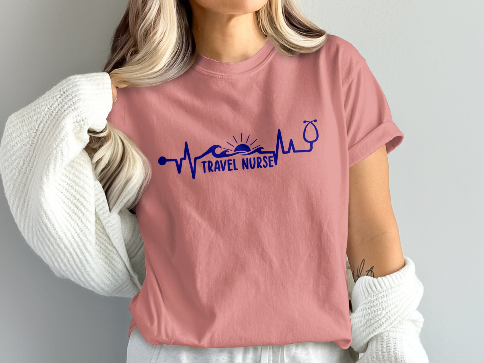 Rose t-shirt with "Travel Nurse" text and stethoscope heartbeat graphic.
