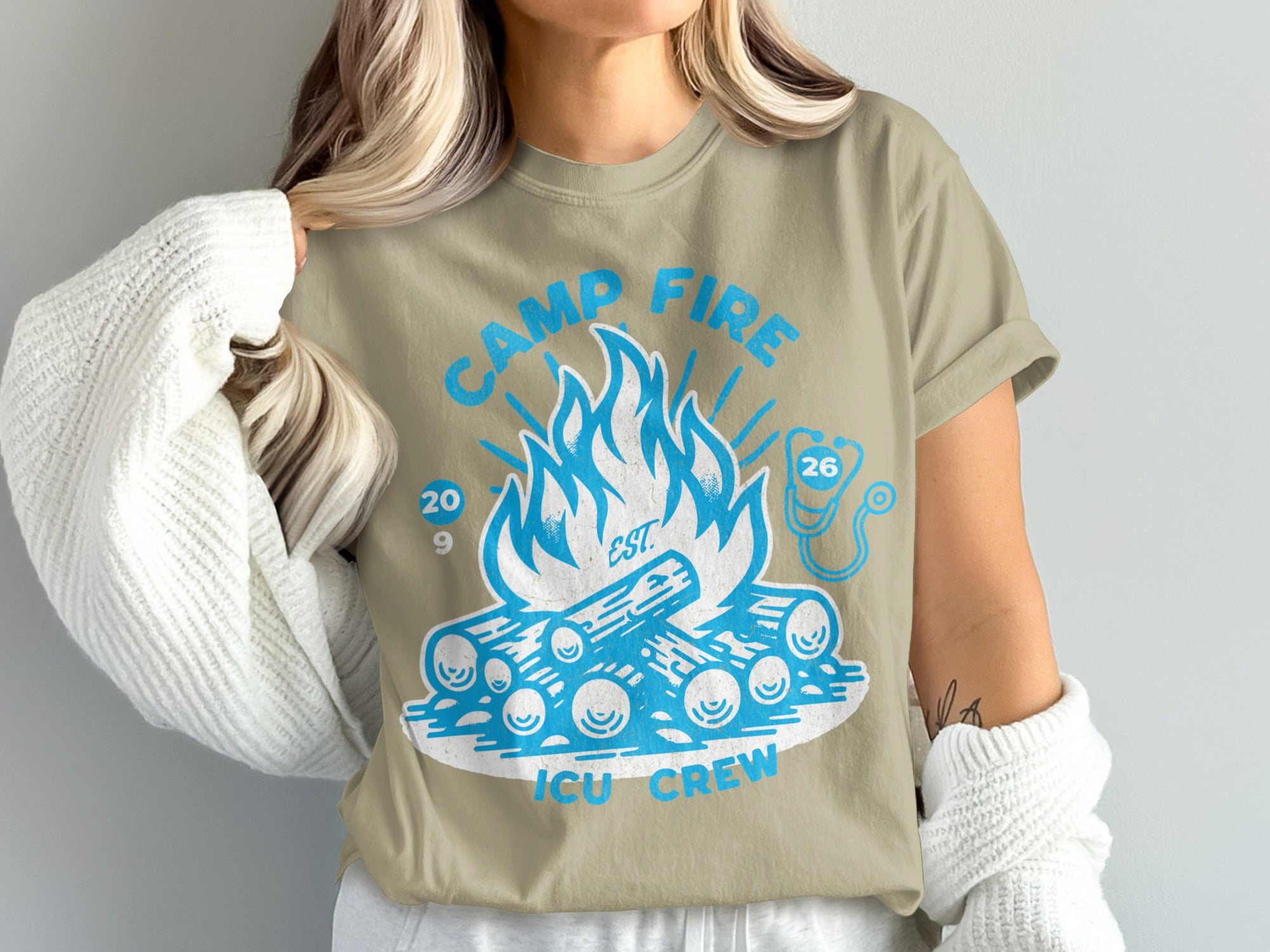 Tan t-shirt with "Camp Fire ICU Crew" graphic featuring a campfire and stethoscope.