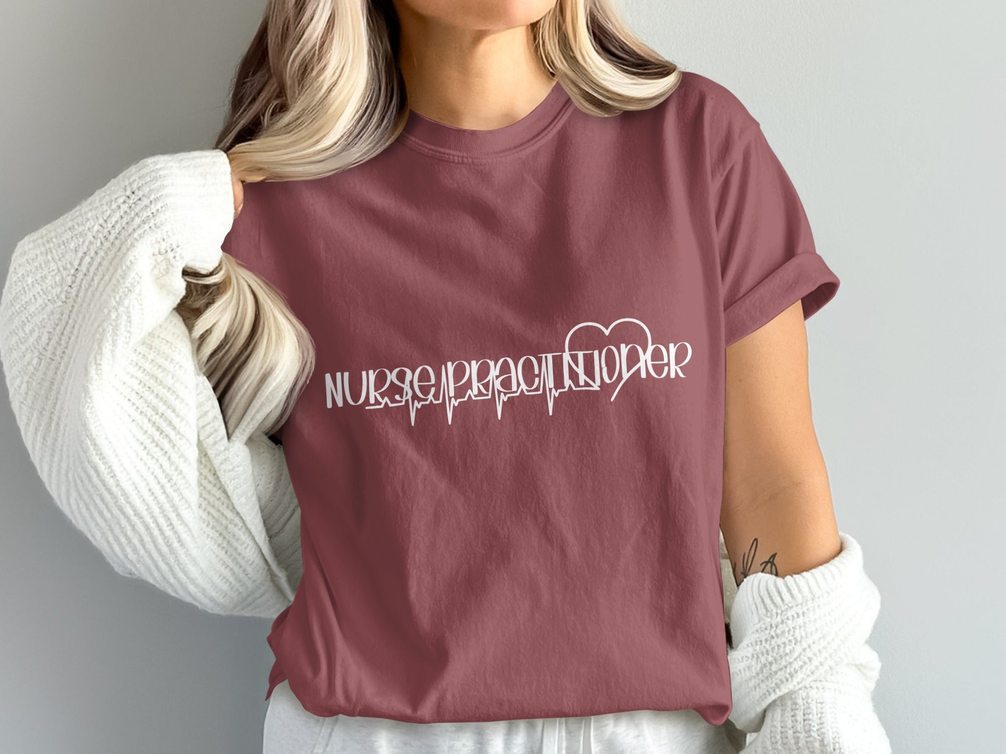 Maroon t-shirt with "Nurse Practitioner" in white script and a heartbeat line.