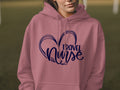 Pink hoodie with "Travel Nurse" text inside a heart outline.