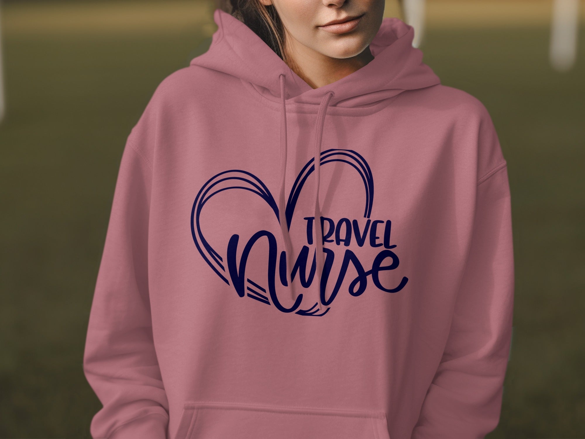 Pink hoodie with "Travel Nurse" text inside a heart outline.