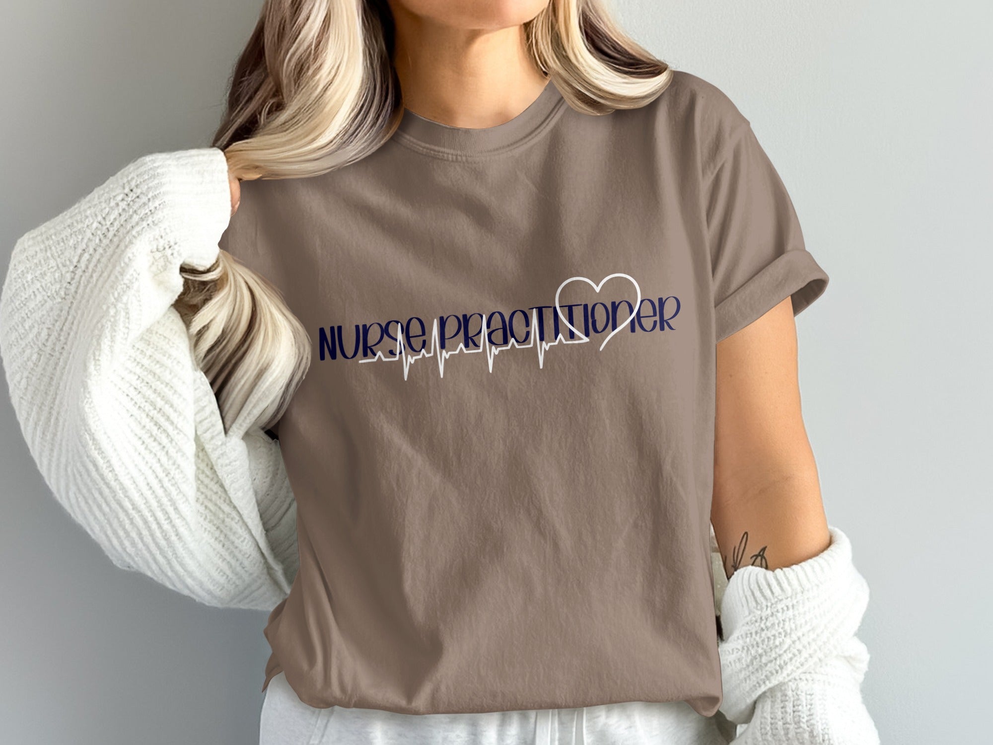 Brown t-shirt with "Nurse Practitioner" and heartbeat graphic.