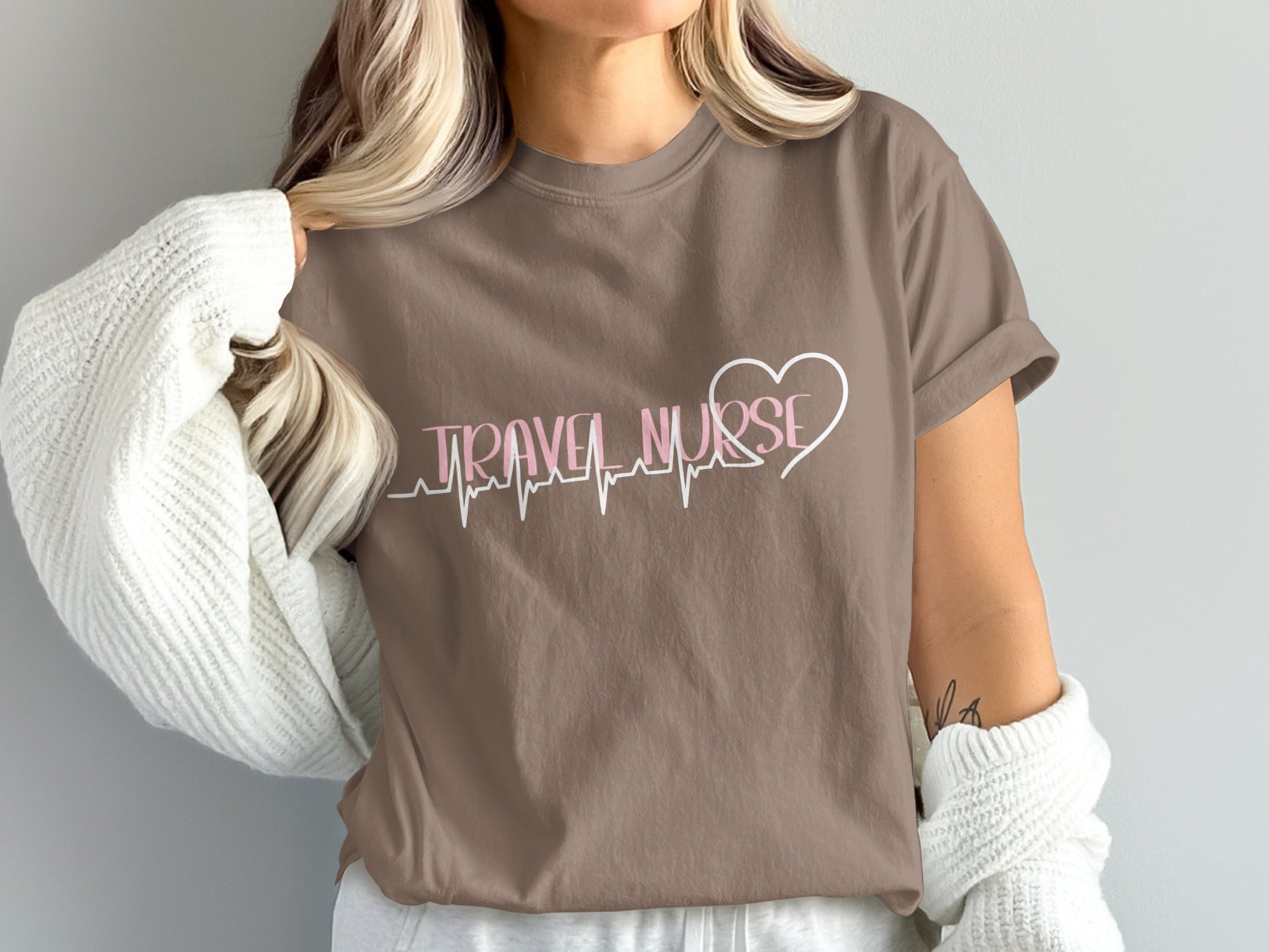 Brown t-shirt with "TRAVEL NURSE" text and a heartbeat line.
