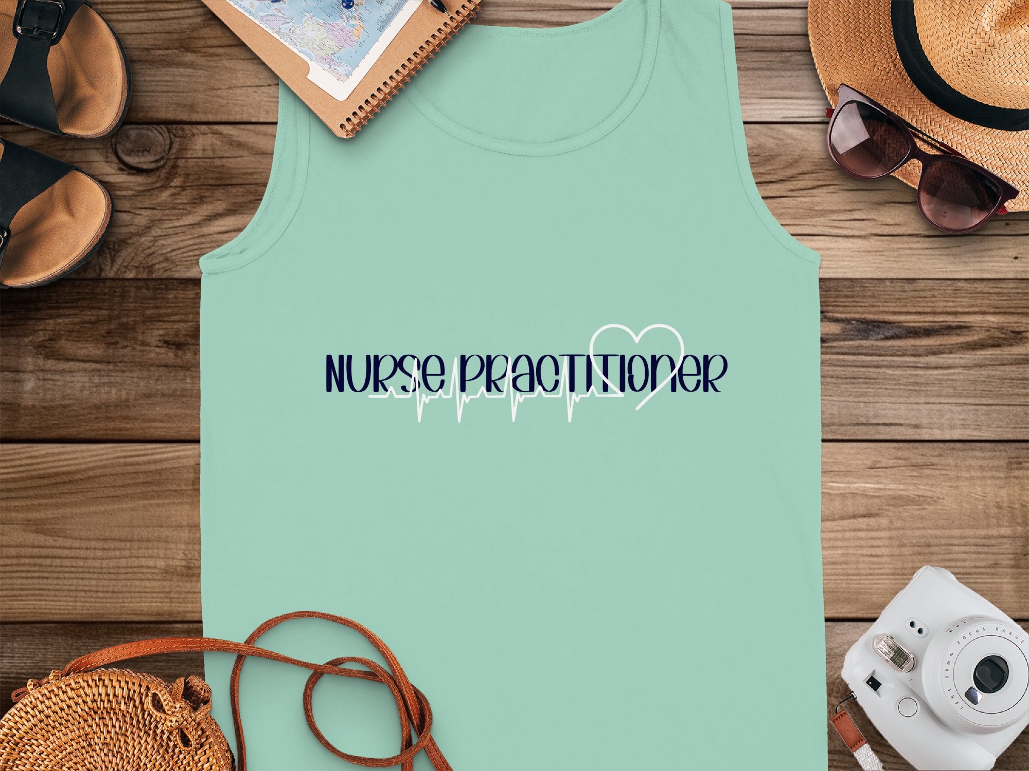 Mint green tank top with "NURSE PRACTITIONER" and a heart monitor line.