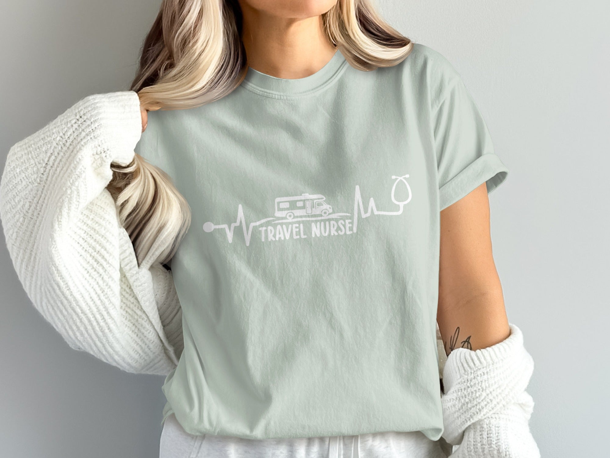 Light green t-shirt with "TRAVEL NURSE" and RV/stethoscope graphic.