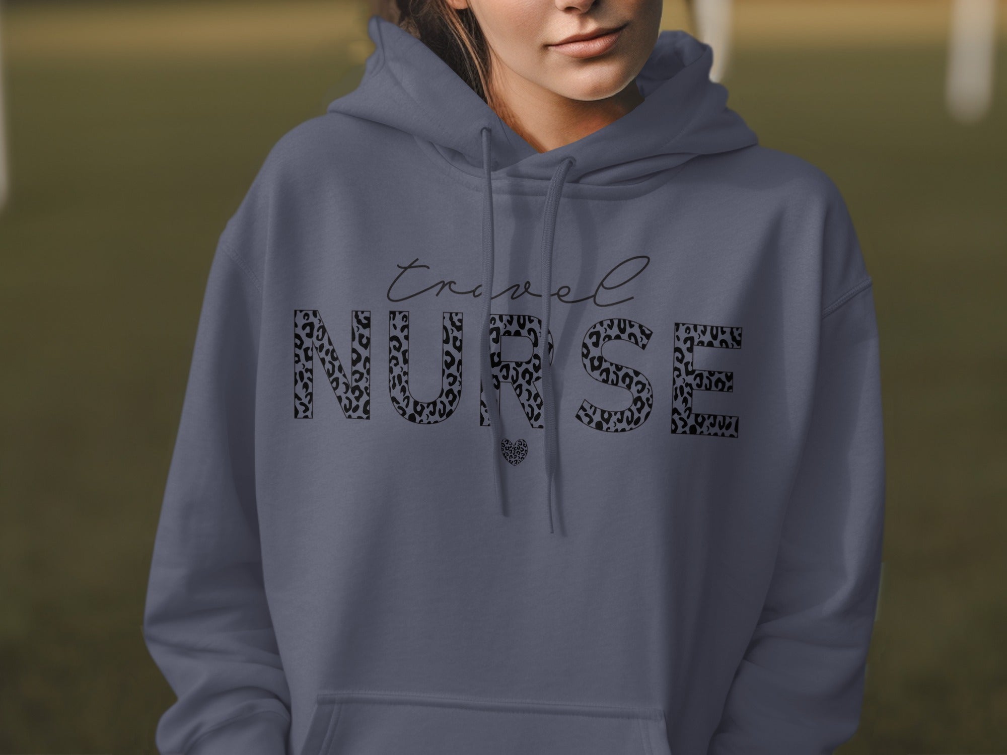 Navy blue hoodie with "travel NURSE" text in leopard print.