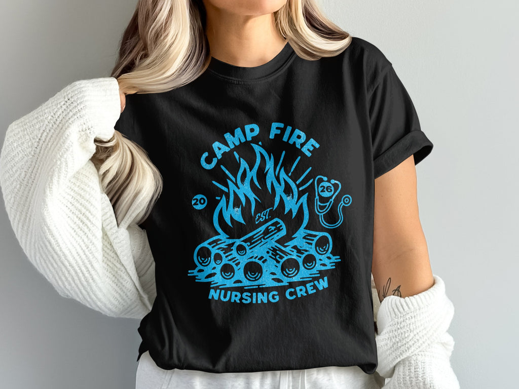 Black t-shirt with a campfire graphic and "Camp Fire Nursing Crew" text.