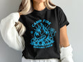 Black t-shirt with a campfire graphic and "Camp Fire Nursing Crew" text.