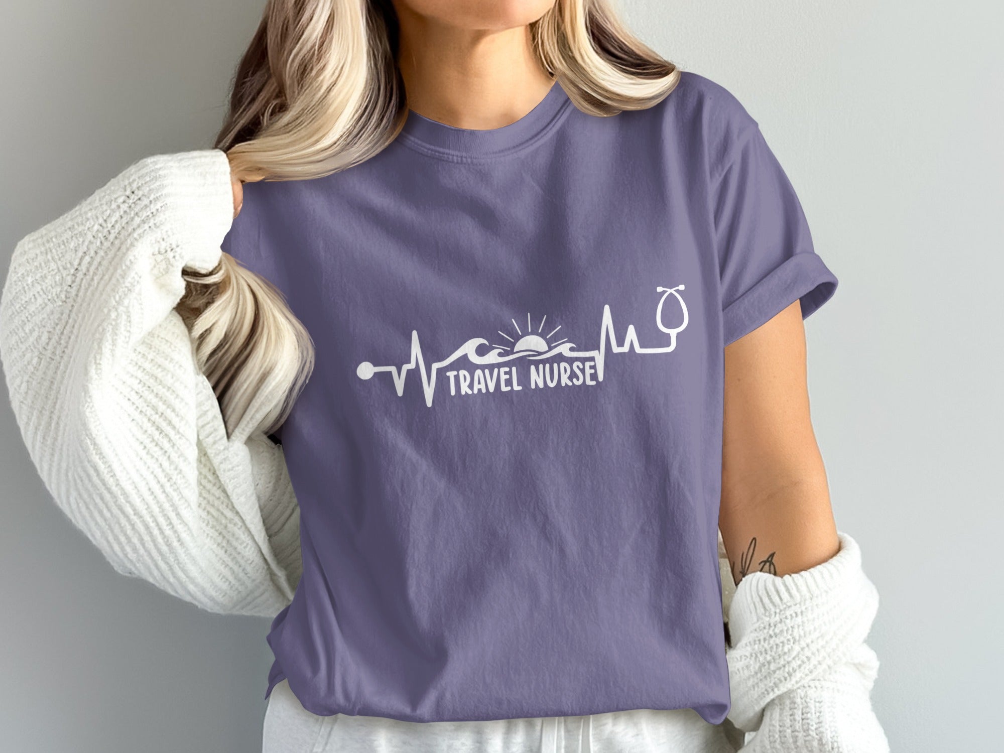 Purple t-shirt with "Travel Nurse" text and heartbeat graphic.