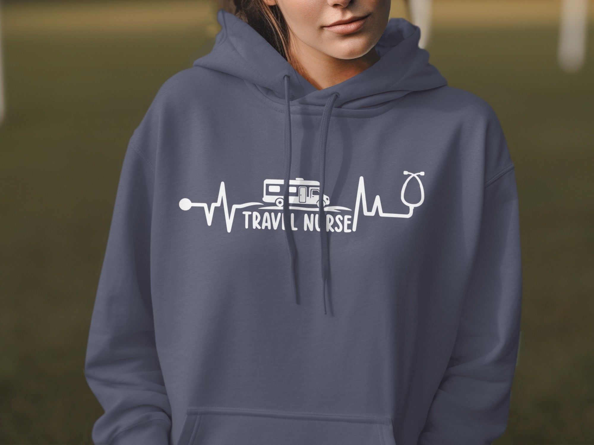 Dark blue hoodie with "Travel Nurse" text and RV graphic on a heartbeat line.