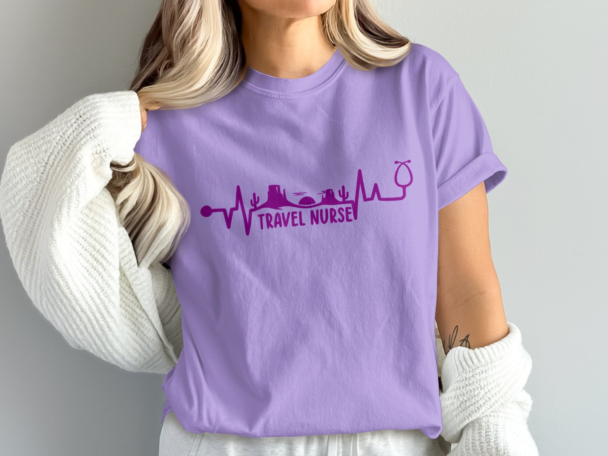 Purple t-shirt with "Travel Nurse" and stethoscope heartbeat design.